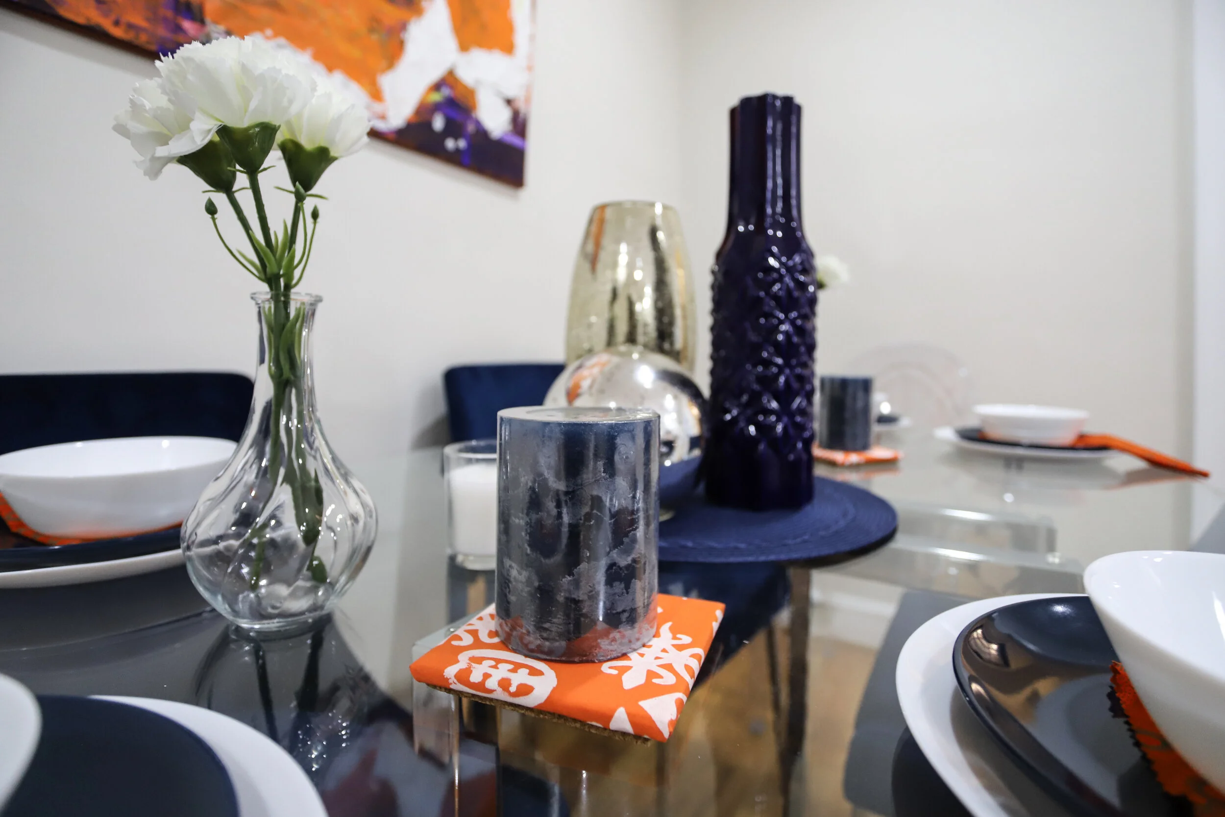  Similarly, Nicole Decor aims to curate spaces that allow the buyer to experience the home at its best. She decorated the home with a mixture of her own art and products from local small businesses, including ours. Nicole Decor styled the open kitche