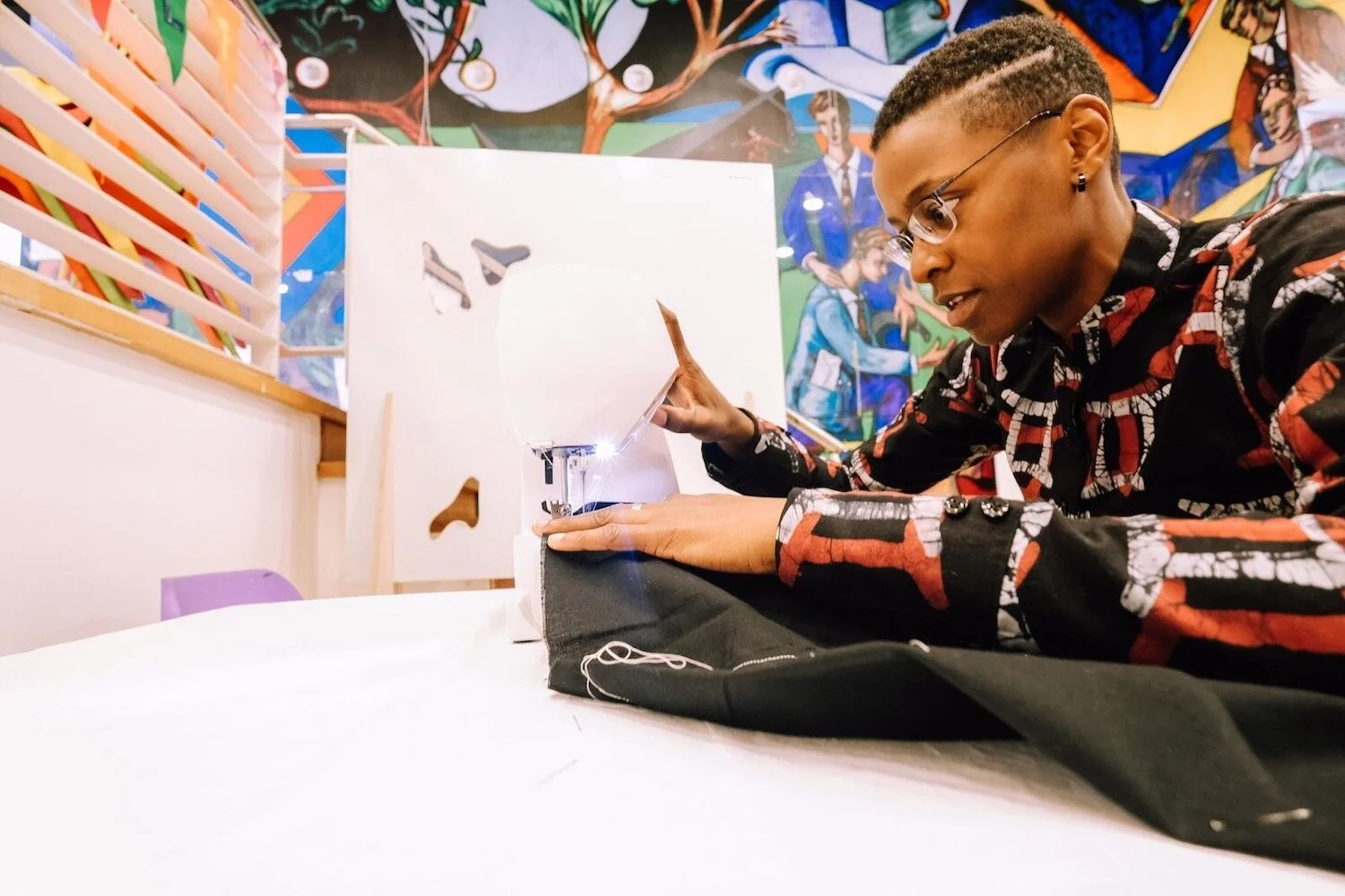  Wax Print Film Director, Aiwan Obinyan, wears a shirt made with AFROTHREADS Gemini fabric. 