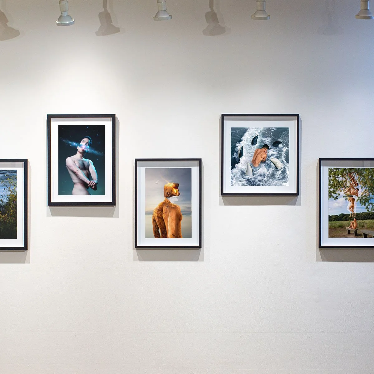 Gallery wall with five framed photographs of people in various outdoor and artistic settings.