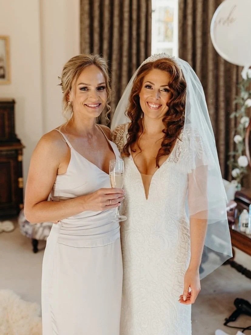 Bride and maid of honour ready to walk down the aisle