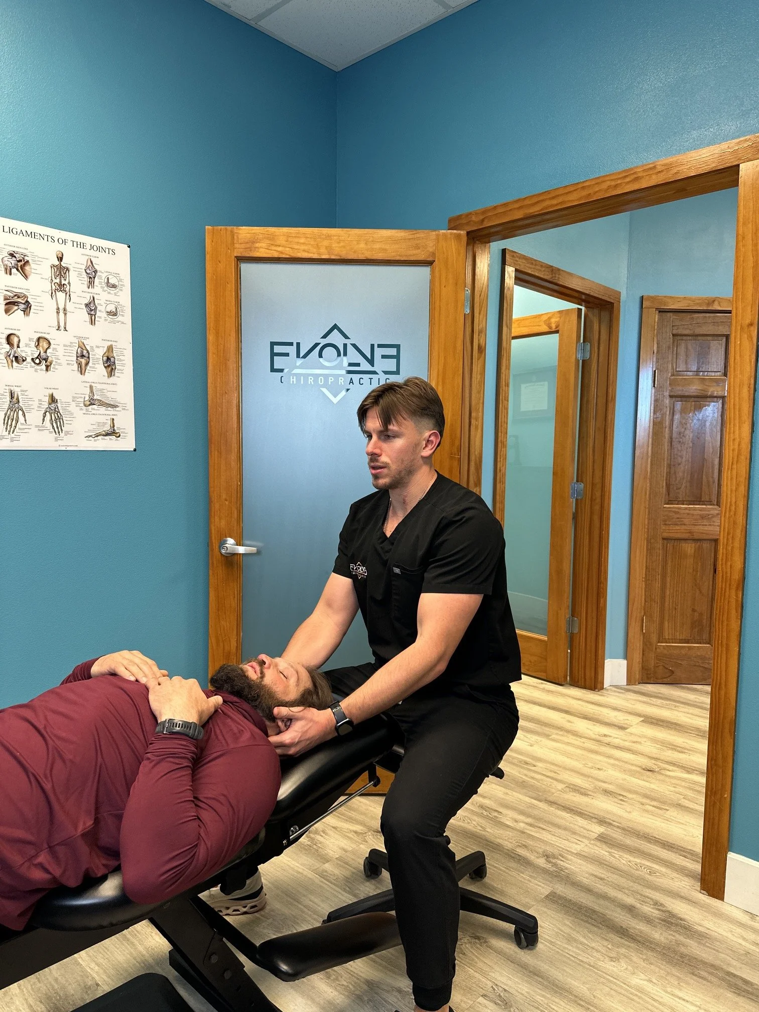 Car accident chiropractor in Dripping Springs, TX evaluating a patient after a motor vehicle collision