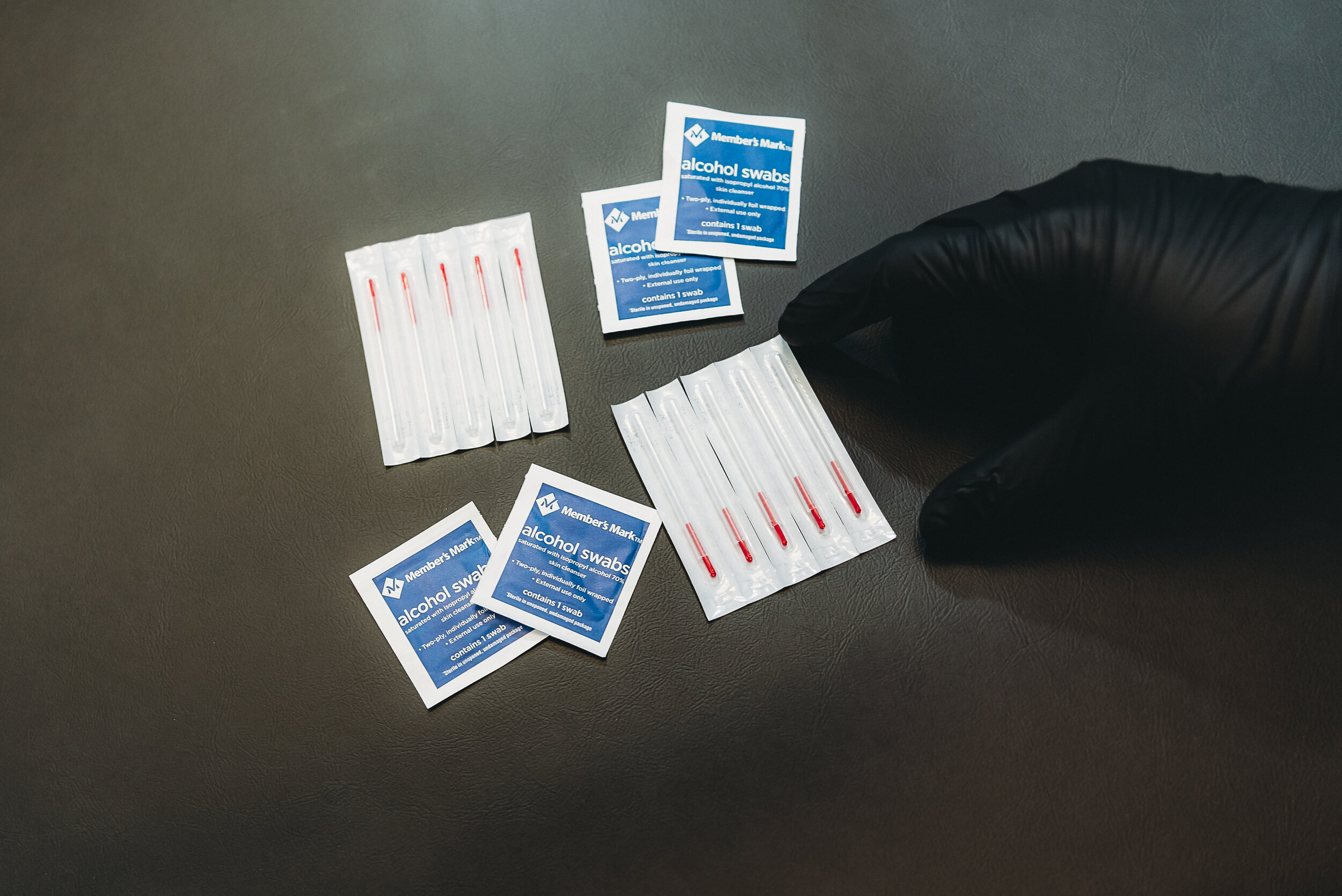 Chiropractor performing dry needling therapy at Evolve Chiropractic in Dripping Springs