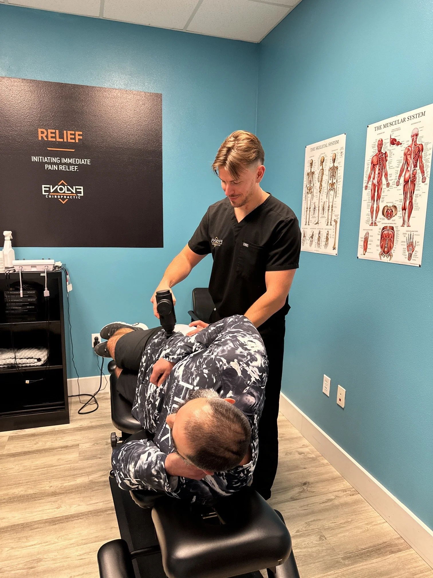 Chiropractor in Dripping Springs, TX helping a patient with low back pain