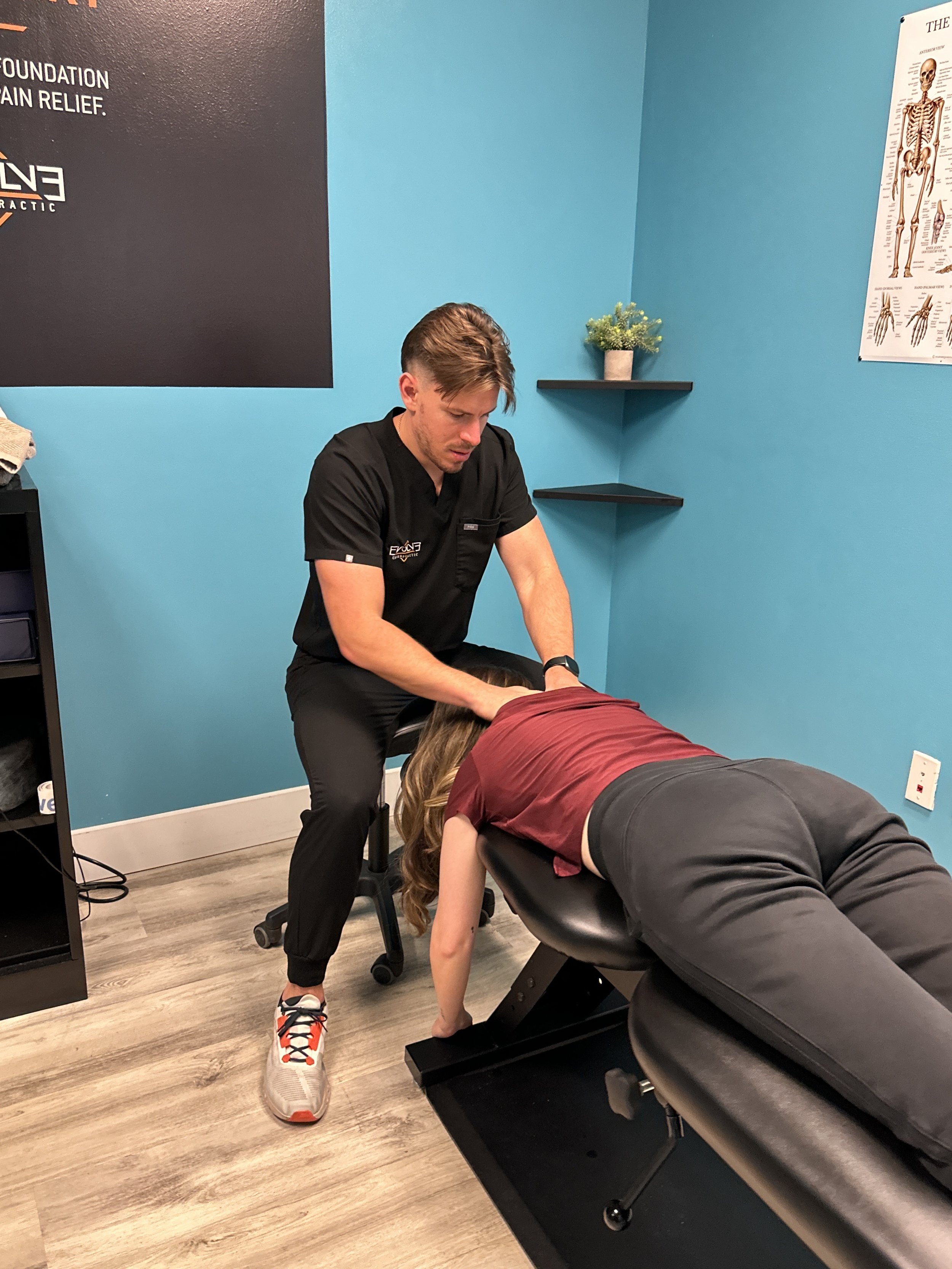 Chiropractor in Dripping Springs, TX helping a patient with low back pain