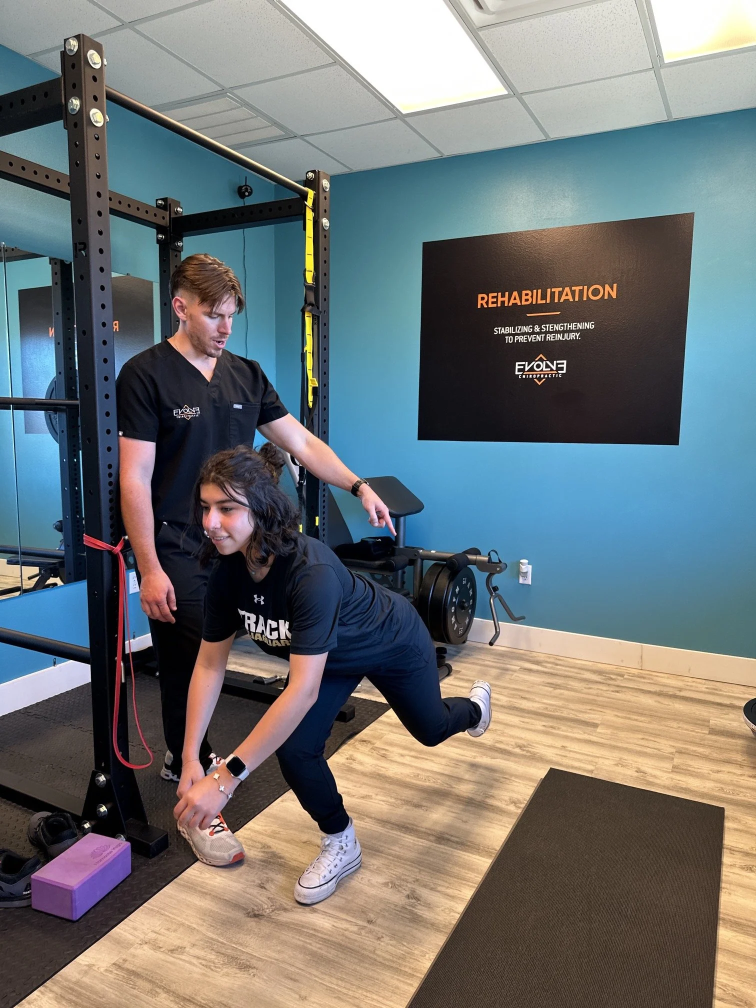 Chiropractor guiding rehab exercises for injury recovery in Dripping Springs, TX