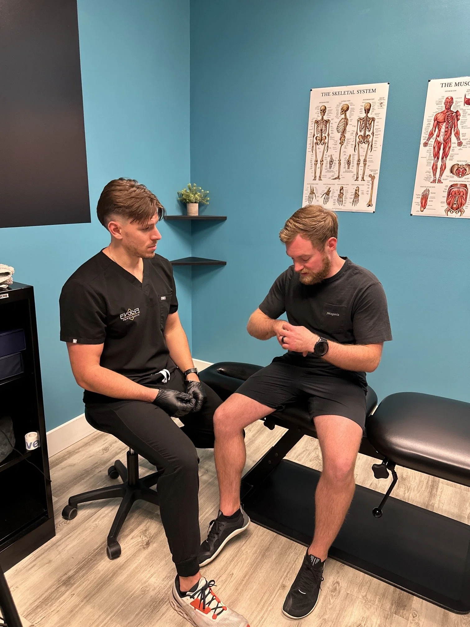 Chiropractor performing dry needling therapy at Evolve Chiropractic in Dripping Springs