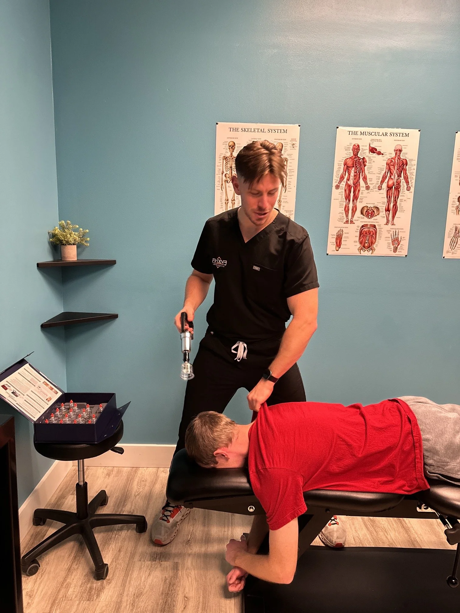 Shoulder rehabilitation exercises at Evolve Chiropractic in Dripping Springs