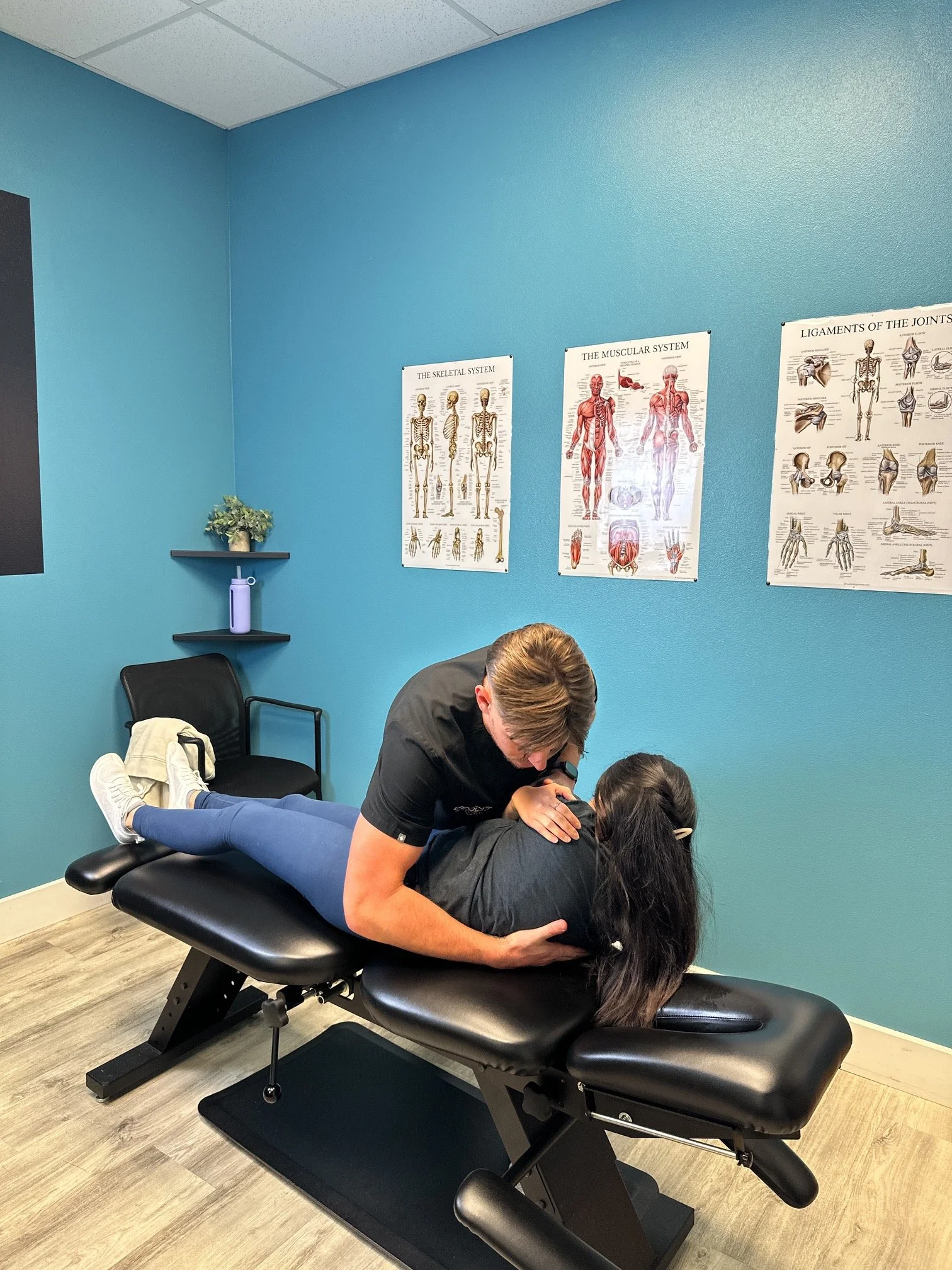 Dr. Jackson Humphrey evaluating posture correction needs at Evolve Chiropractic in Dripping Springs, TX