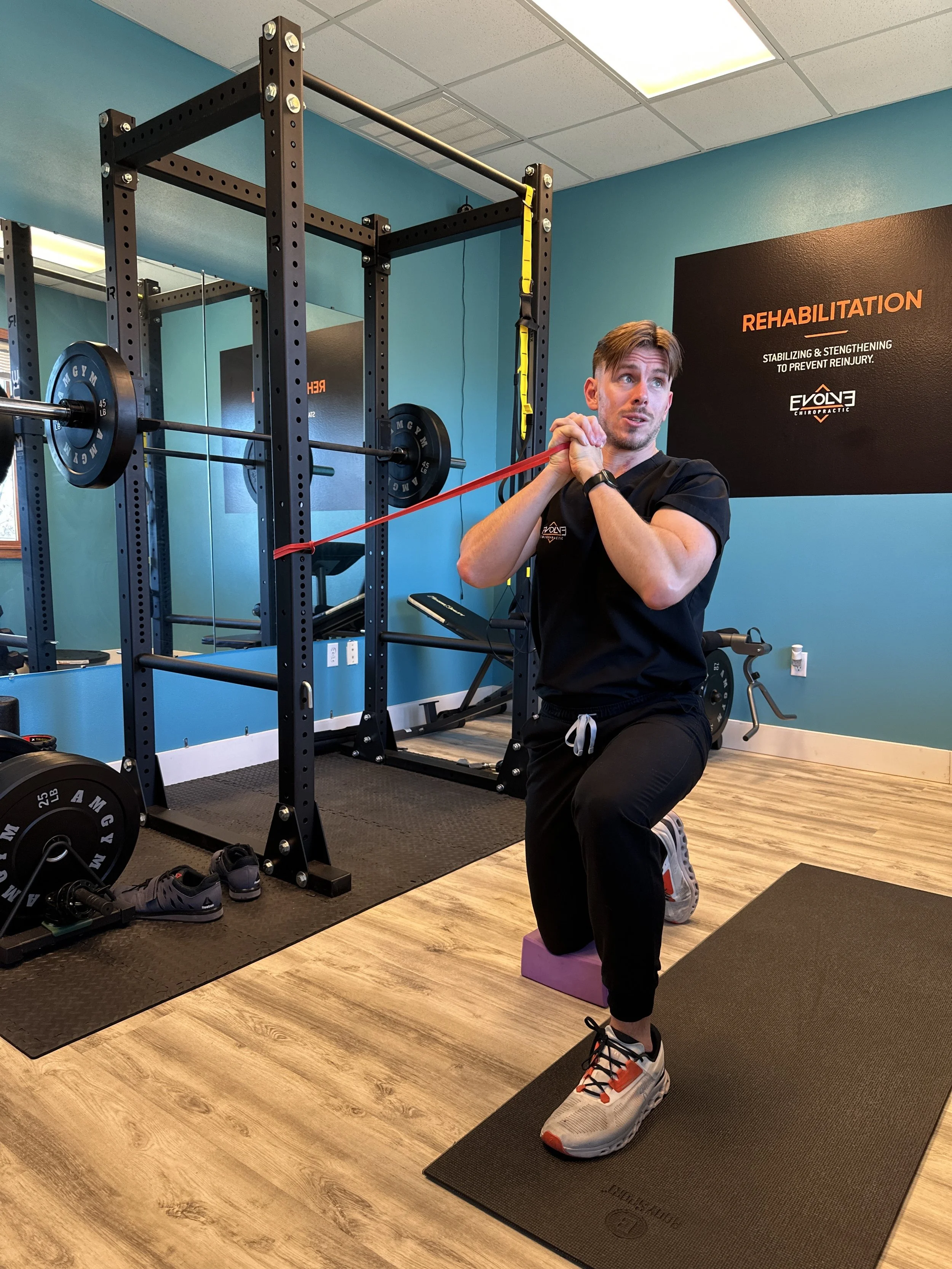 Rehabilitation exercises for spinal stability at Evolve Chiropractic in Dripping Springs