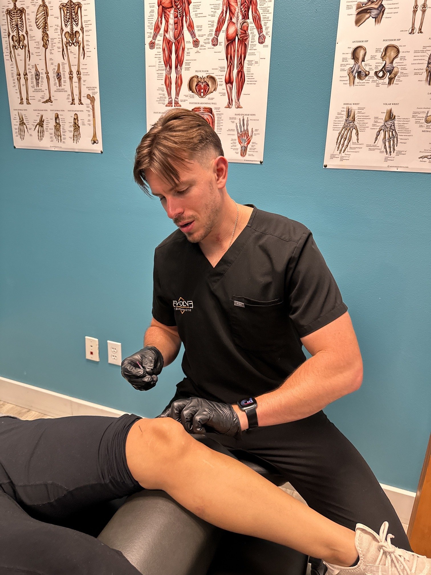 hiropractor performing dry needling therapy at Evolve Chiropractic in Dripping Springs
