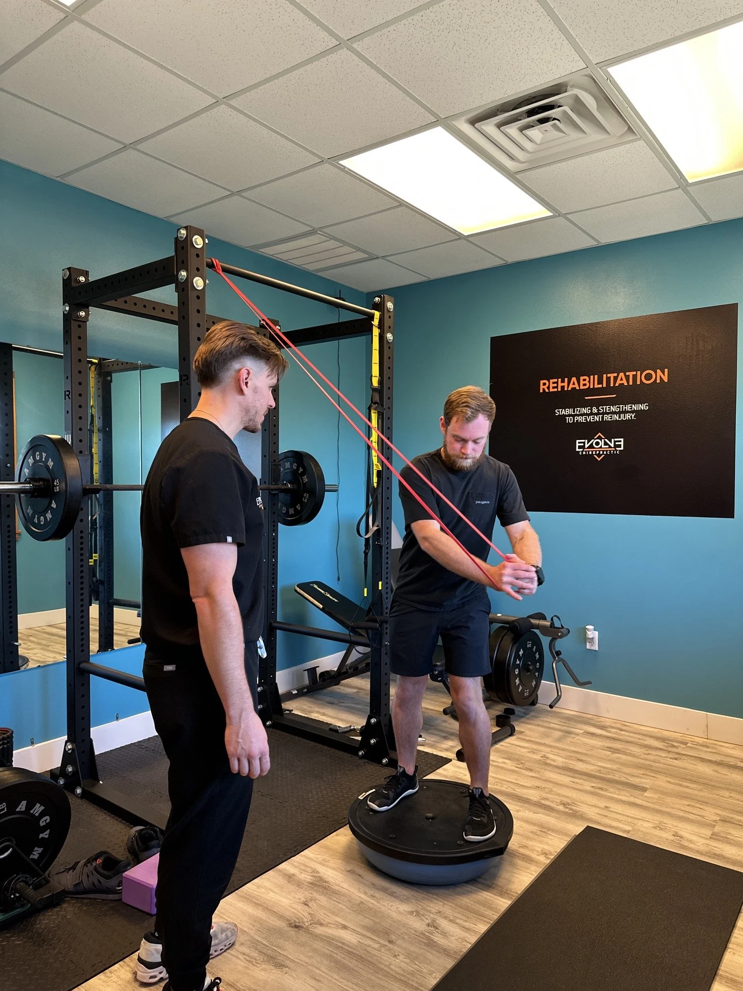 Patient performing hip strengthening and rehabilitation exercises at Evolve Chiropractic in Dripping Springs