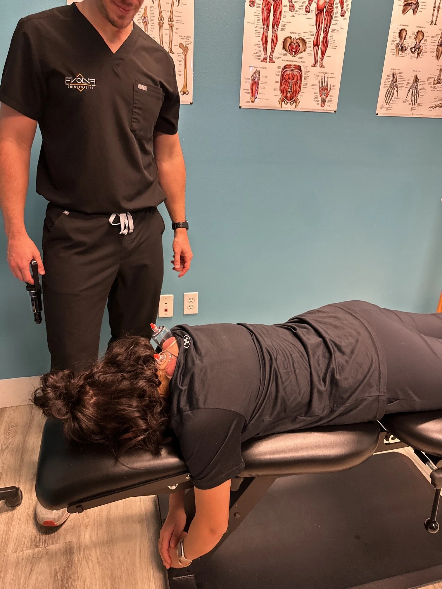 Athlete receiving cupping therapy at Evolve Chiropractic in Dripping Springs