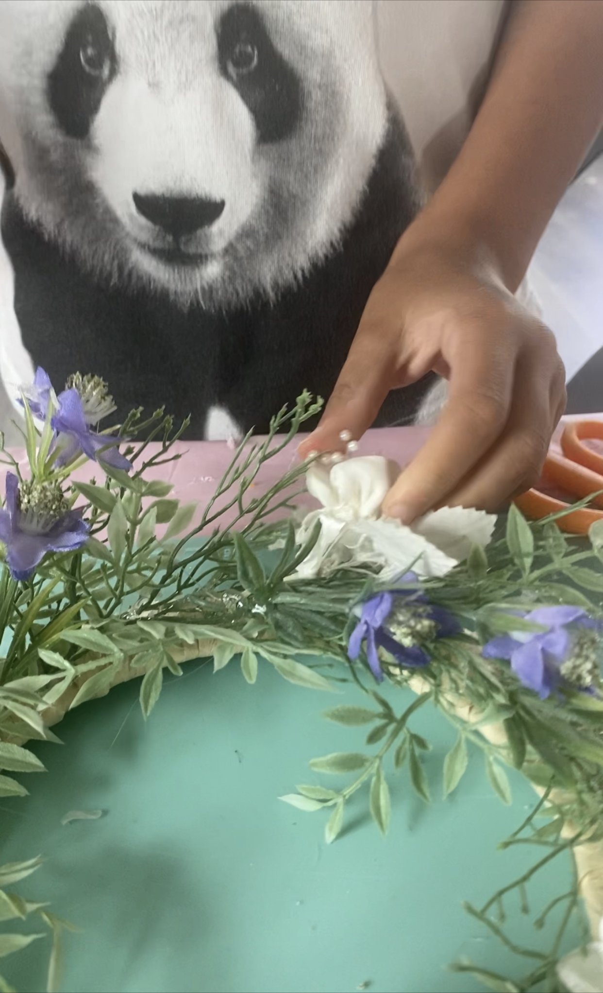 IMG_ester making wreath with shells.jpg