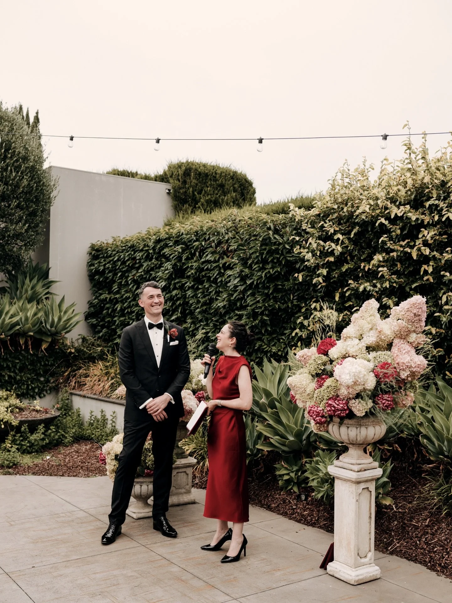 A Favourite Moment.

Mikaela, just out of sight. The guests, gathered from different corners of the couple&rsquo;s lives, brought together because of love.

Standing next to John (a man of genuine skyscraper proportions), I was very glad I&rsquo;d wo