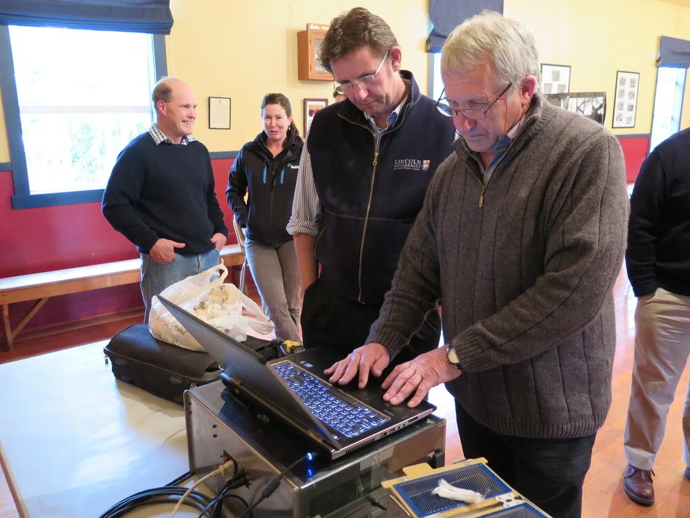 Lincoln University geneticist Jon Hickford (middle) and FibreScan technician Donny Morrison (right)