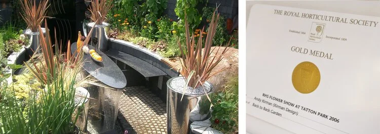 A garden water feature with a small black fountain in the center, surrounded by plants in pots, and a certificate from the Royal Horticultural Society with a gold medal award.
