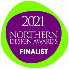 2021 Northern Design Awards finalist badge with purple center and green border