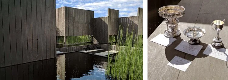 A split image with a modern wooden building with water and greenery on the left, and silver jewelry or decorative items with papers on the right.