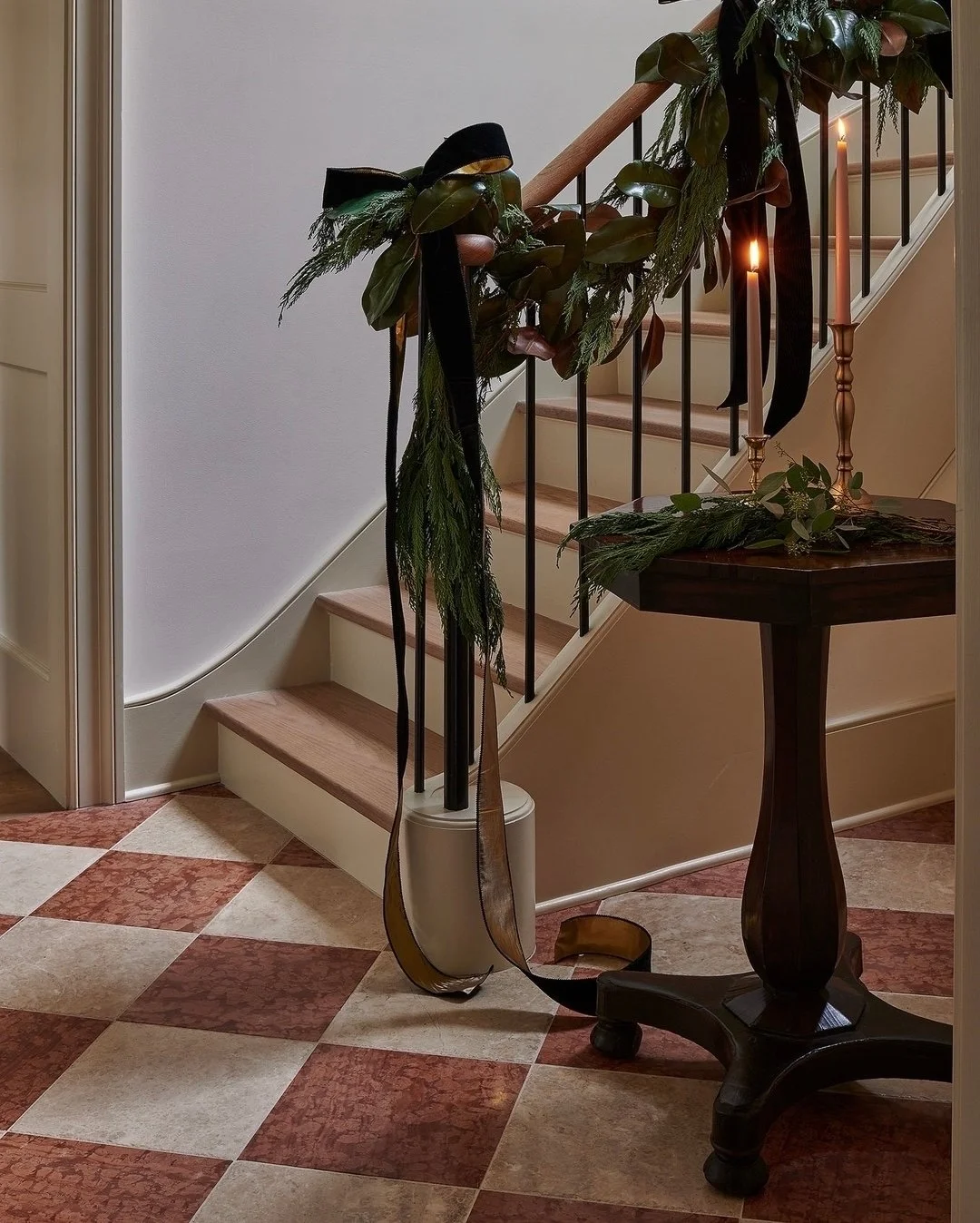 "We've always been big fans of the bow trend&mdash;and this black velvet moment lives in our hearts forever. Set aglow by candlelight and finished with a couple of special pieces from @firesideantiques, this foyer in @logankilleninteriors' #peti