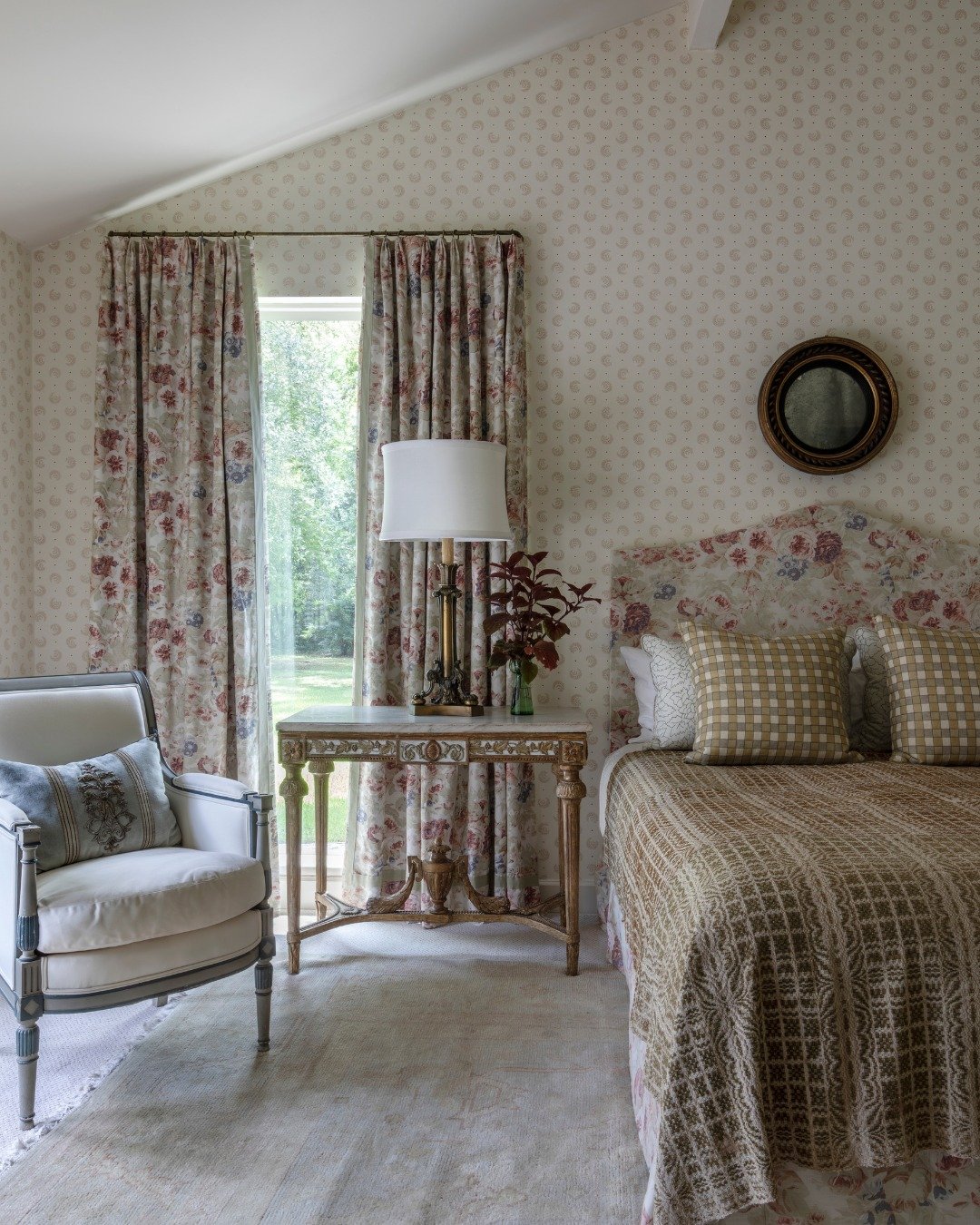 A room with a view, both inside &amp; out! This primary bedroom is balanced by layers of soft florals &amp; organic textures with a foundation of classical details in the collection of French antiques from Fireside!
.
Interior: @laurarolandinteriors
