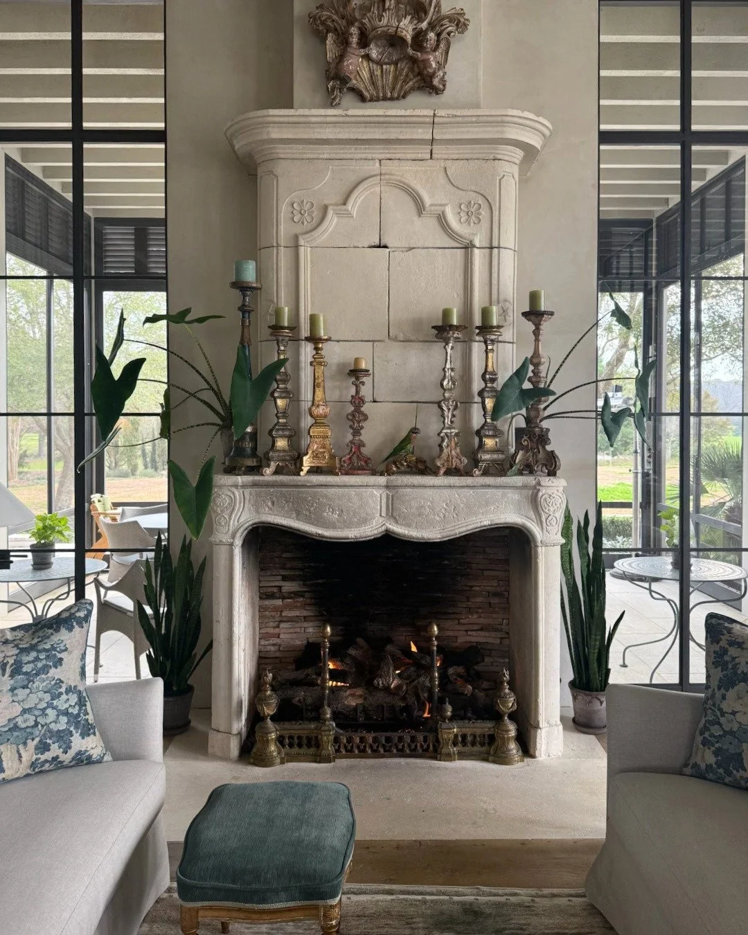 Showcasing how one remarkable focal point can transform an entire room. A mantel offers the perfect stage for styling to anchor your space with collections that change with the seasons.
.
Beautifully patinated hand cut limestone fireplace styled with