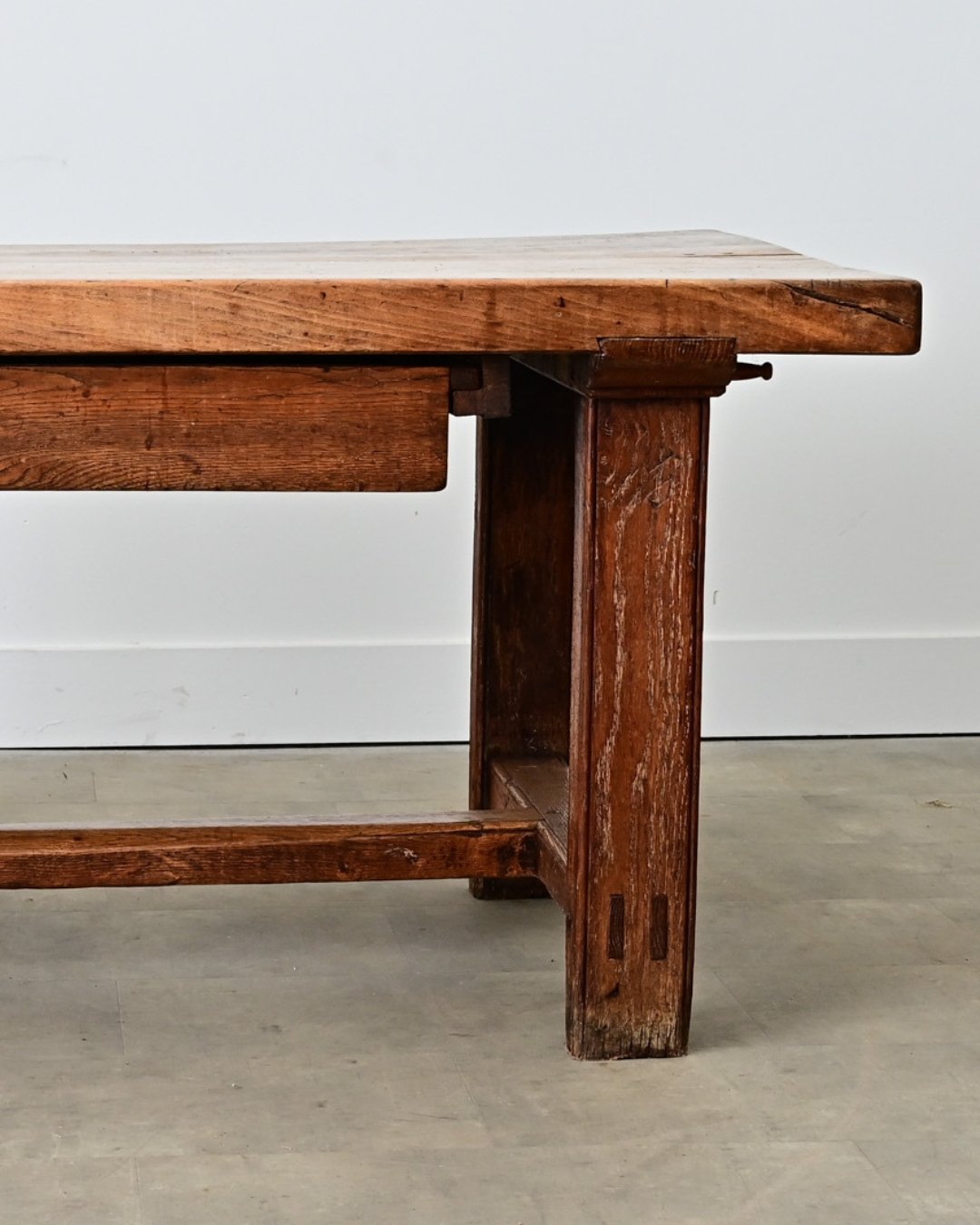 French 19th Century Farmhouse Dining-Worktable, whose robust design is a practical solution for the modern kitchen to pivot between dining &amp; preparation. The beech wood top is an impressive 2 &frac12;&rdquo; thick with a single drawer in the apro