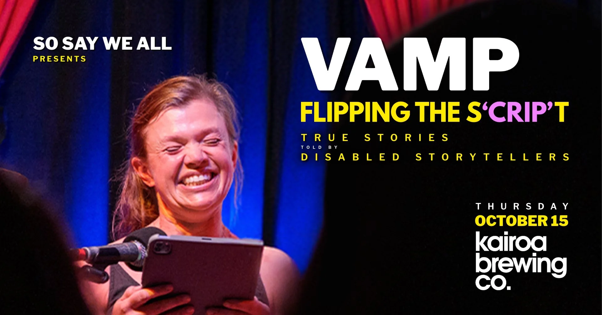 Woman smiling as she reads a story from her iPad to a crowd of people.