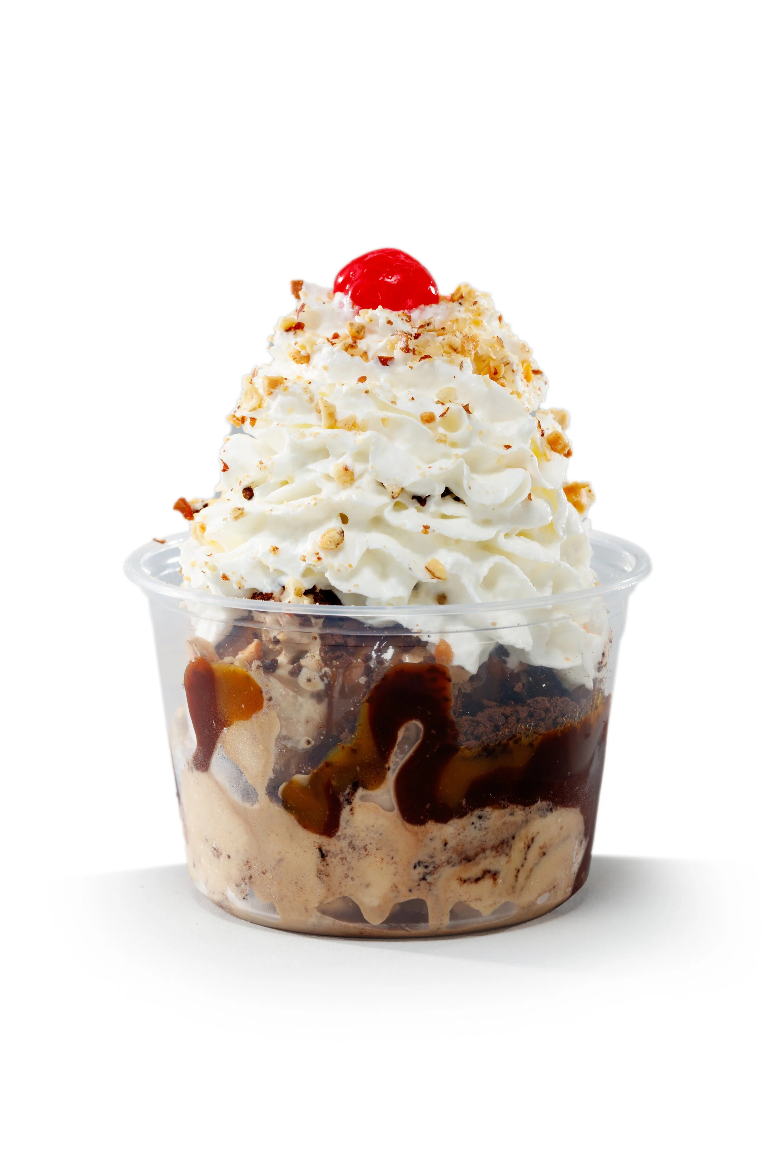 Our MISSISSIPPI MUD PIE! Bittersweet Sin-phony hard ice cream, topped with hot fudge, warm caramel, cookie crunch, whipped cream, nuts and a cherry!