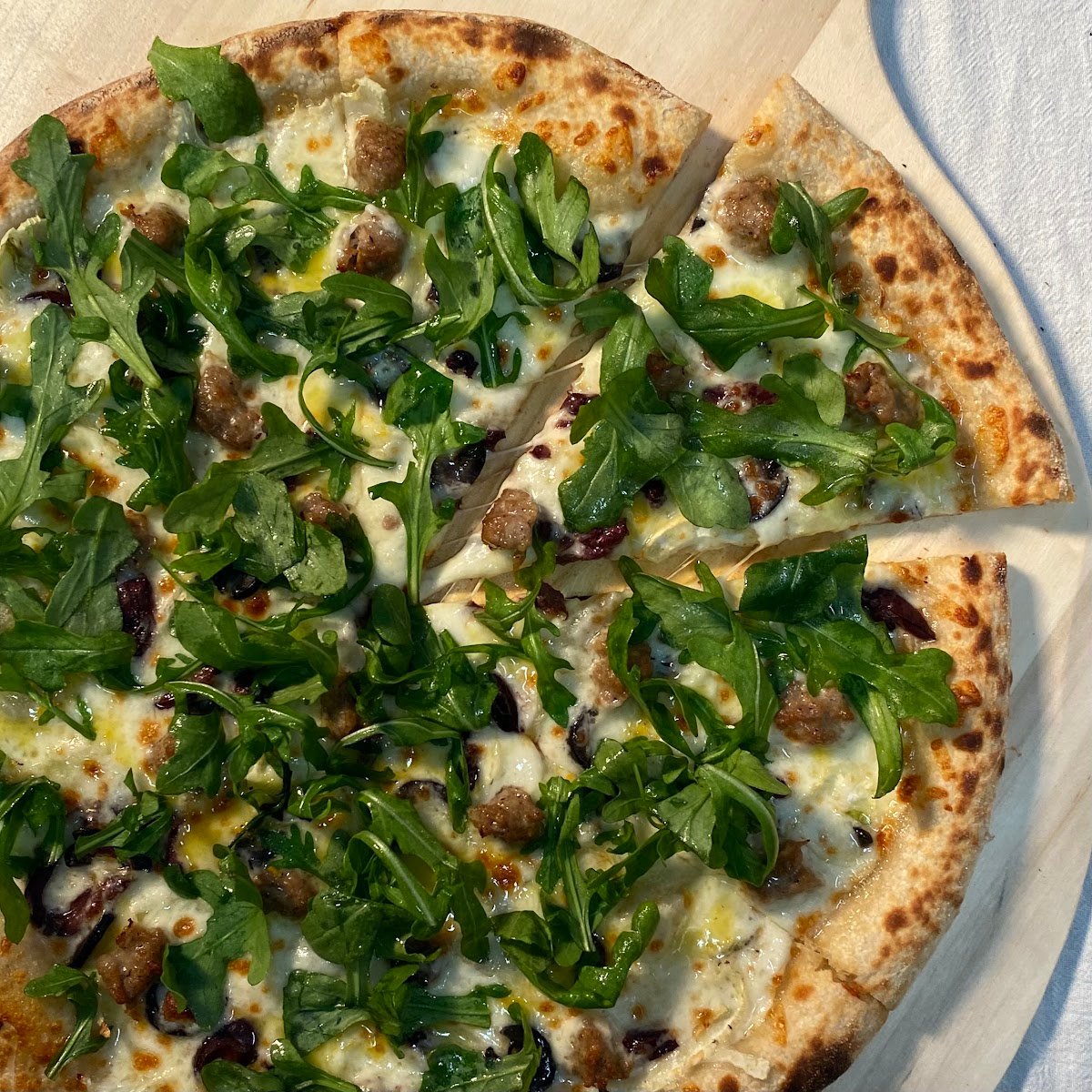 Sausage, fennel, black & kalamata olives with orange-vin & fresh arugula.jpg