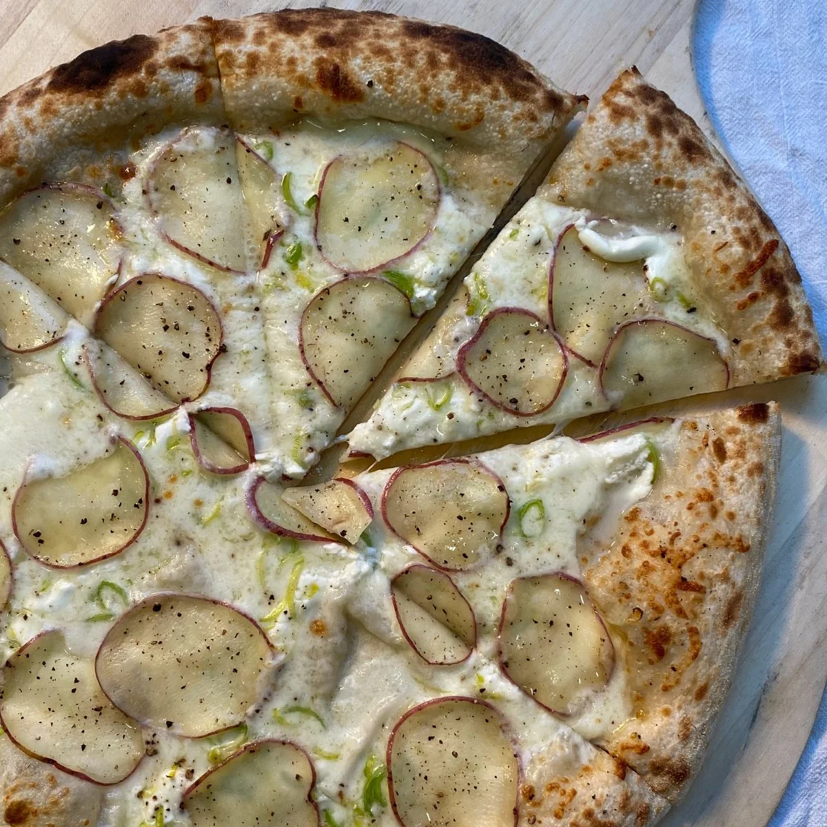 Roasted Potatoes, leeks, sourcream, cheddar-gruyere, black pepper.jpg