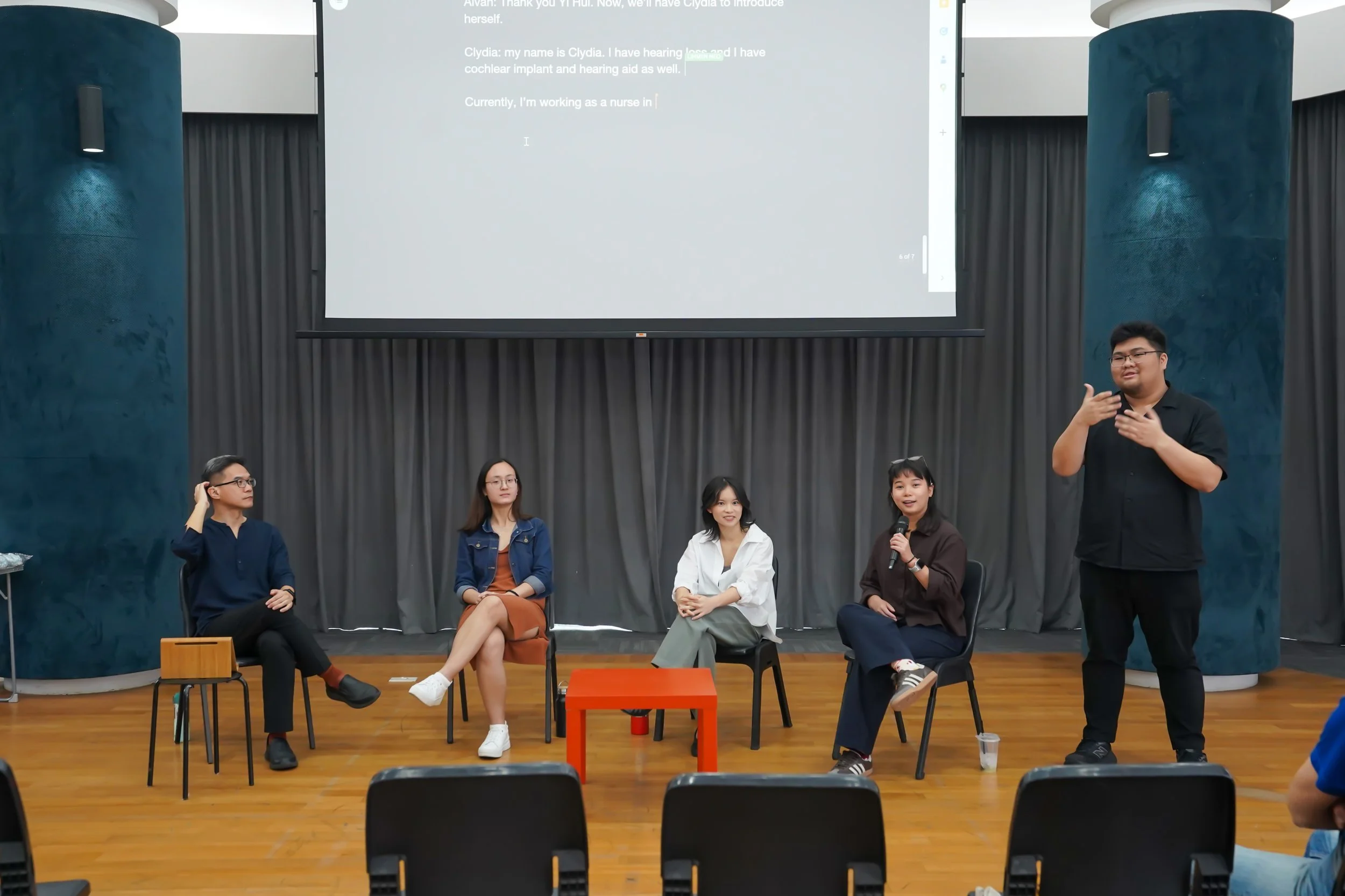 Daniel interpreting for a panel discussion.