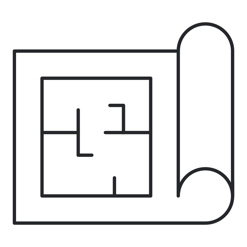 A blueprint with a floor plan and a rolled-up architectural drawing