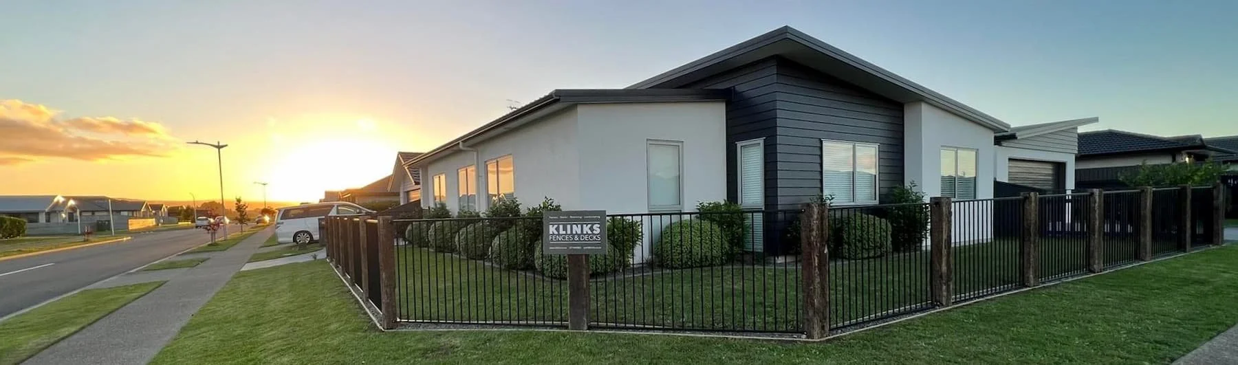 House with sunset and Klinks fencing