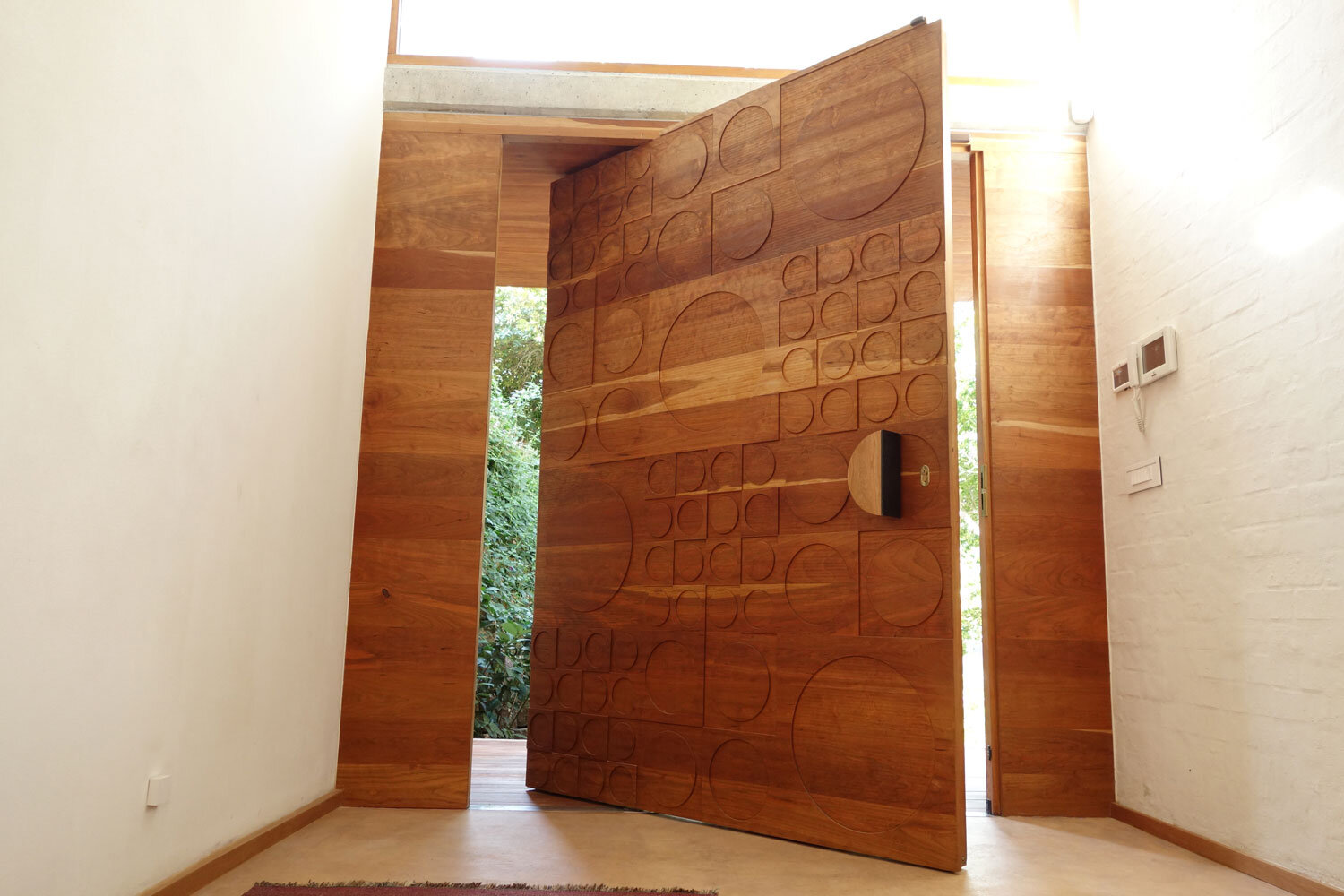 Heavy duty, solid wood pivot door for entrance