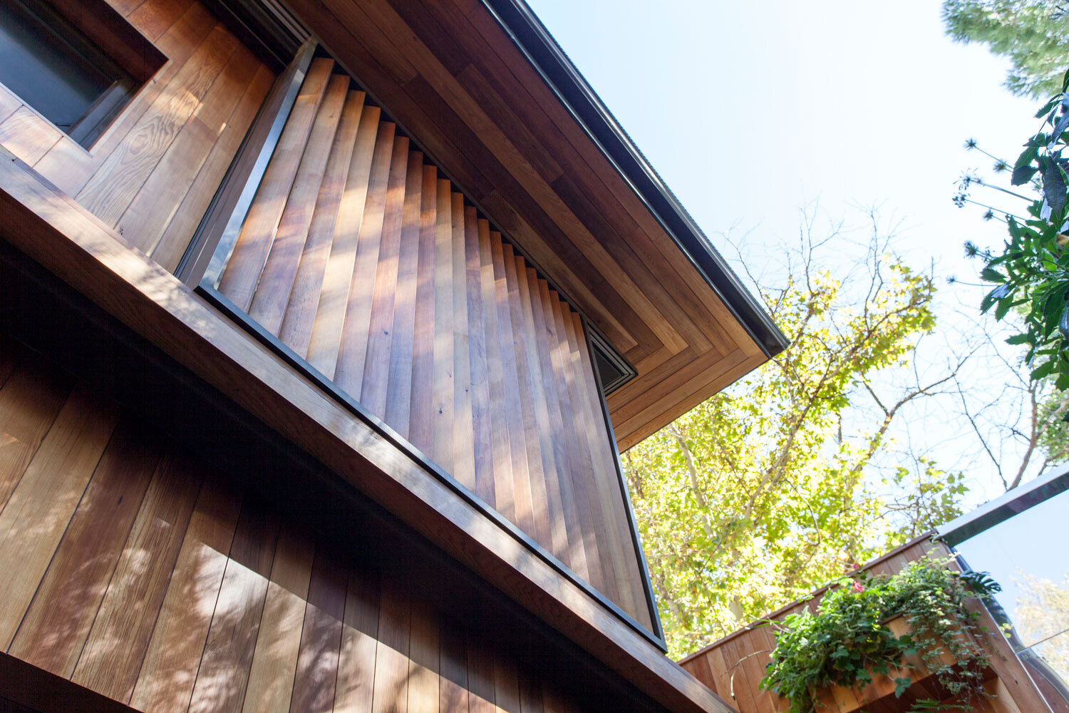 Straight sliding vertical bathroom shutters, exterior view. 