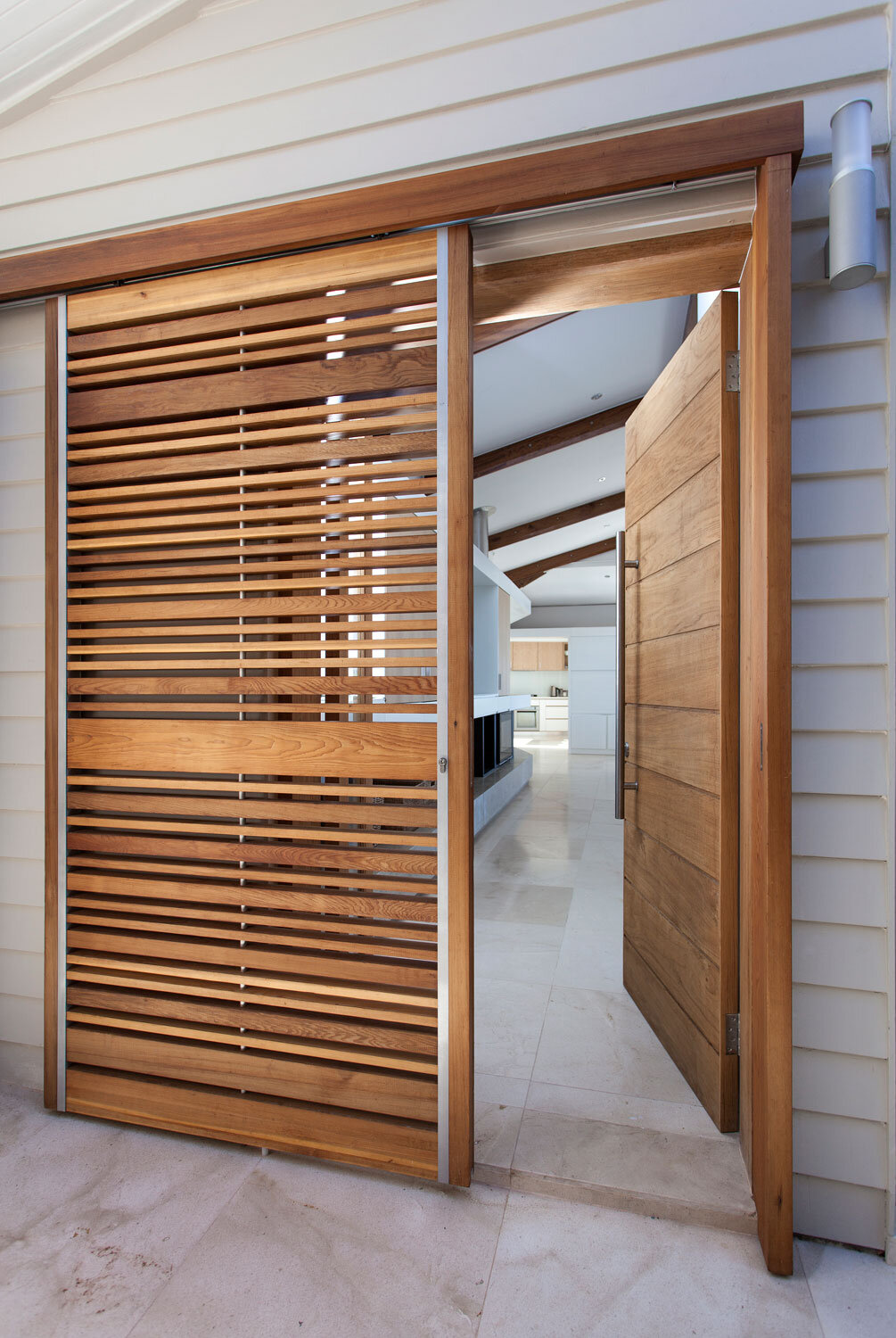 Main entrance security gate, straight sliding elements, customised slat pattern