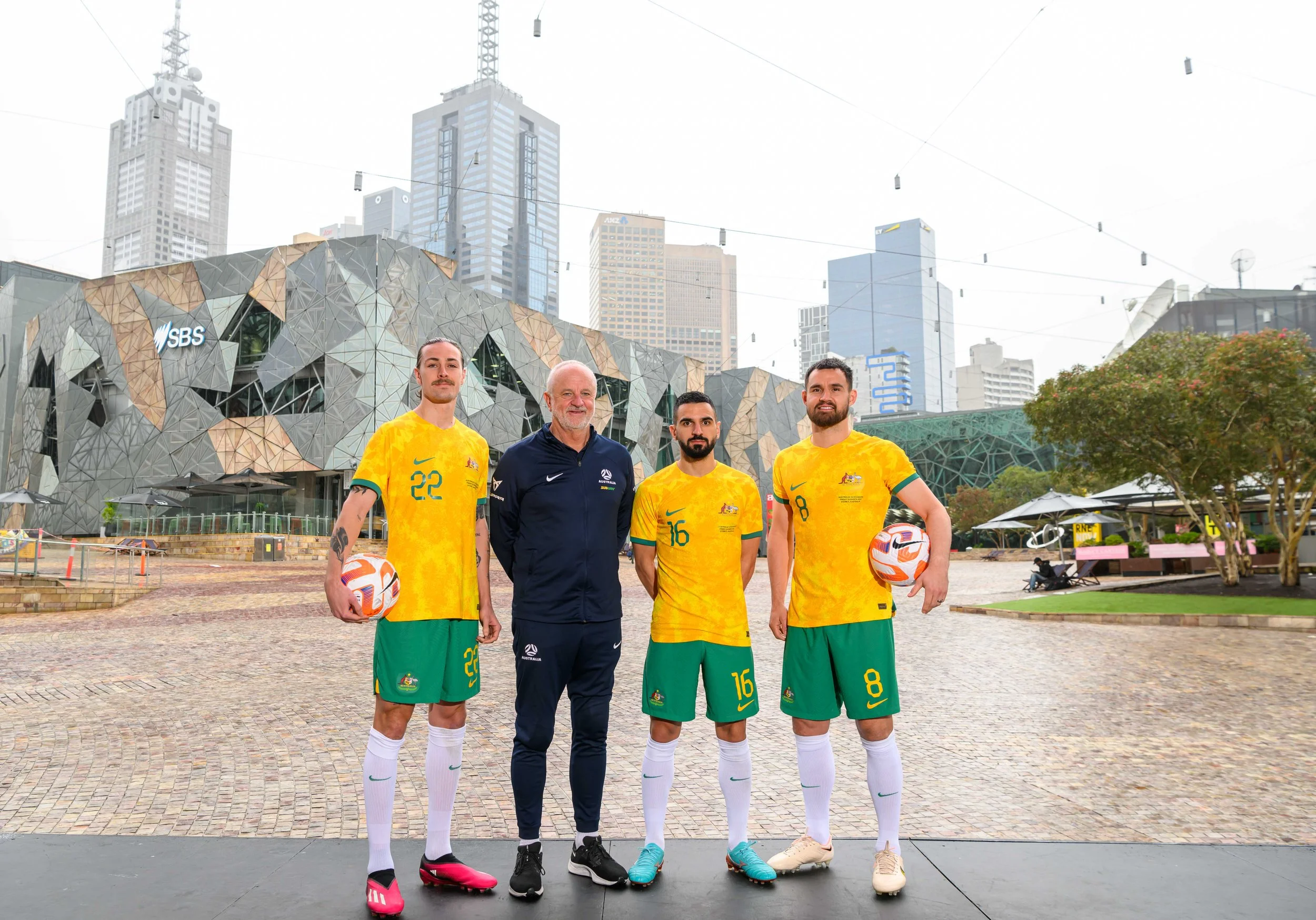 Jackson Irvine, Graham Arnold, Aziz Behich and Bailey Wright | Football Australia | Subway Socceroos Media Call | Main Stage, Federation Square, Melbourne | March 27, 2023