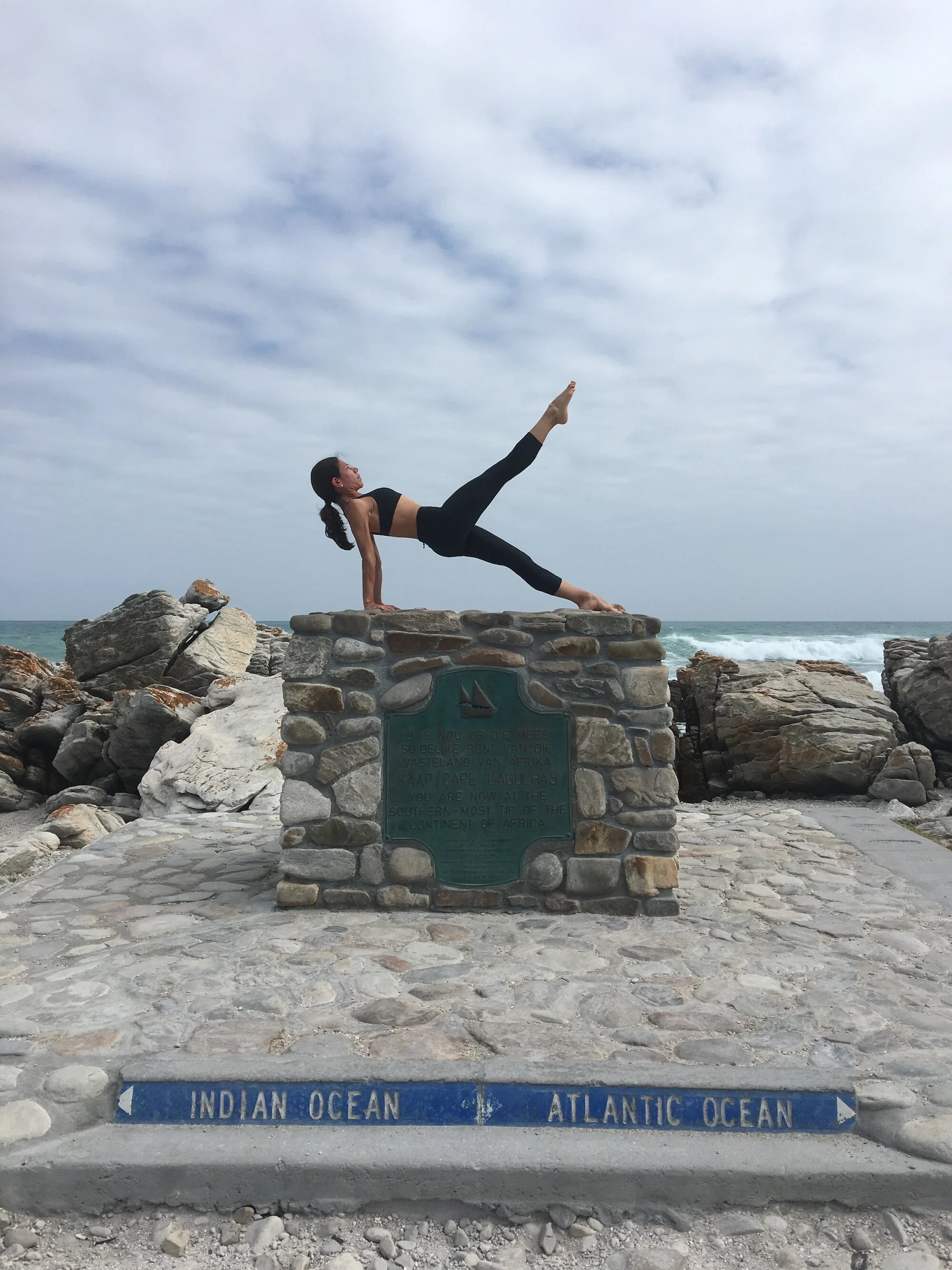woman doing exercise in front of ocean.jpg