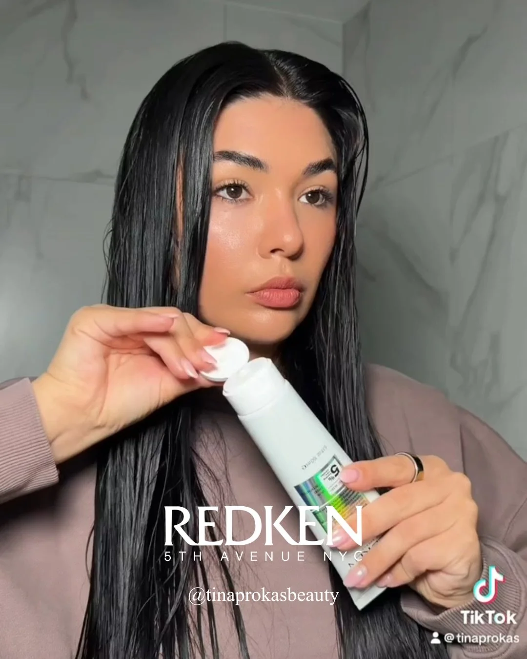 Tina partners with @redken to show how their ABC leave-in treatment and bandage balm strengthens the hair and seals in moisture 🫧