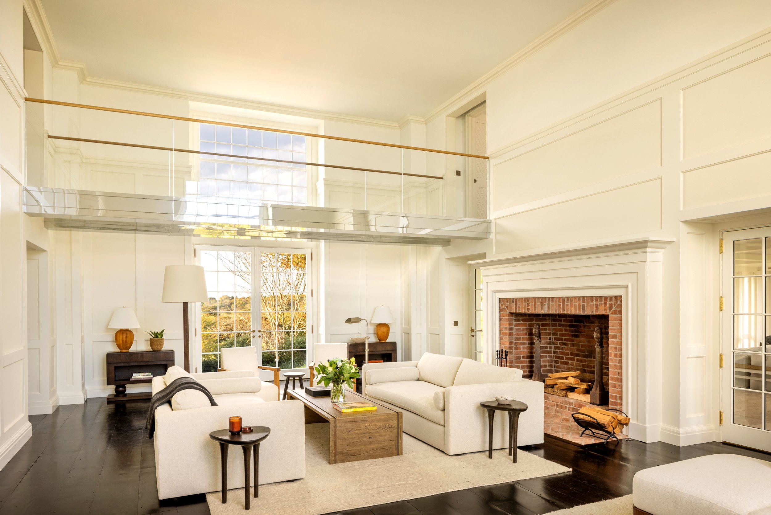 The living room is complemented by a discrete, mirror finish and glass bridge that draws inspiration from the yacht-like feel of the house.