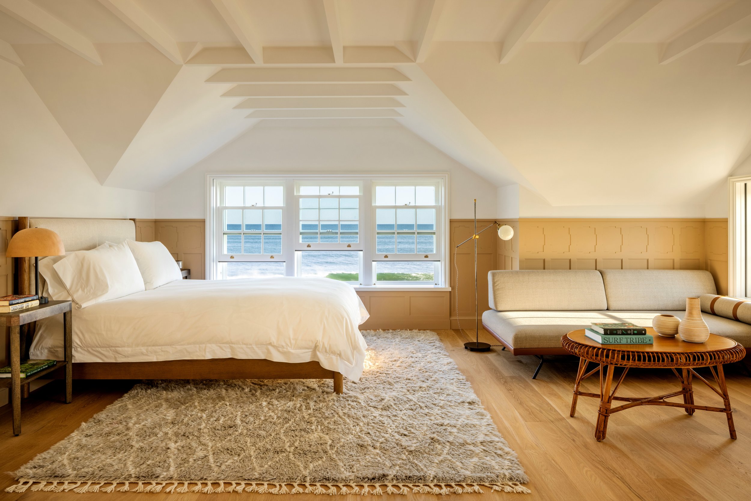 The Guest bedroom suite is tucked under the eaves, and accessed by the Tower stairs; it has three exposures and wood burning fireplace.