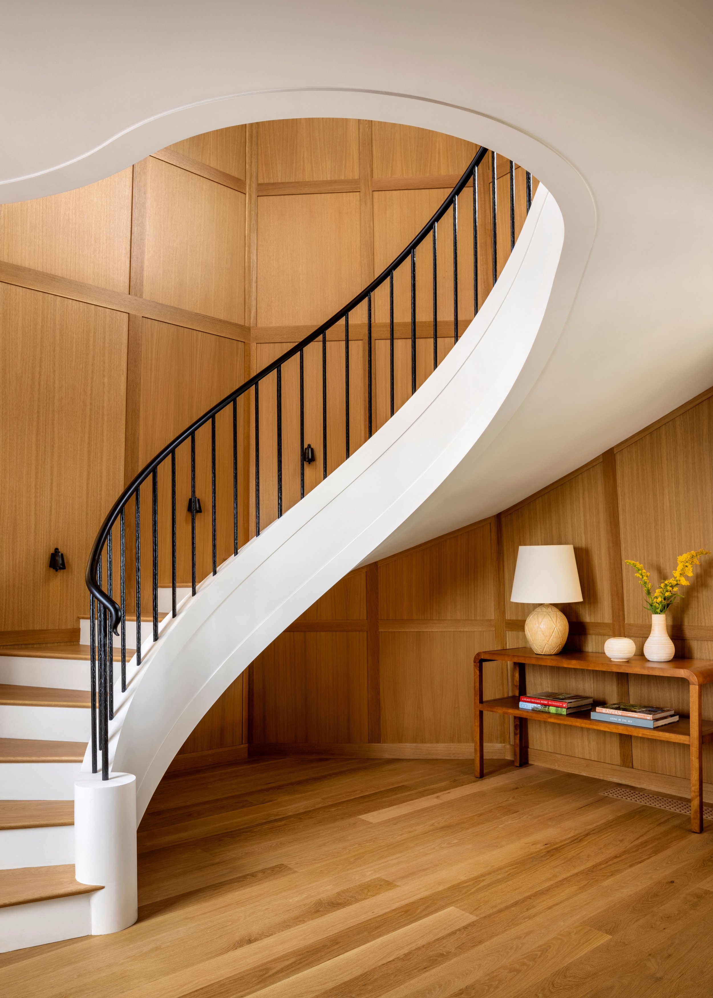 A sculptural stair was added within the existing tower, providing a function on the inside that matches the verticality of the iconic tower, which can be seen from the beach. Marrying complex shapes of the octagonal and battered walls of the tower w