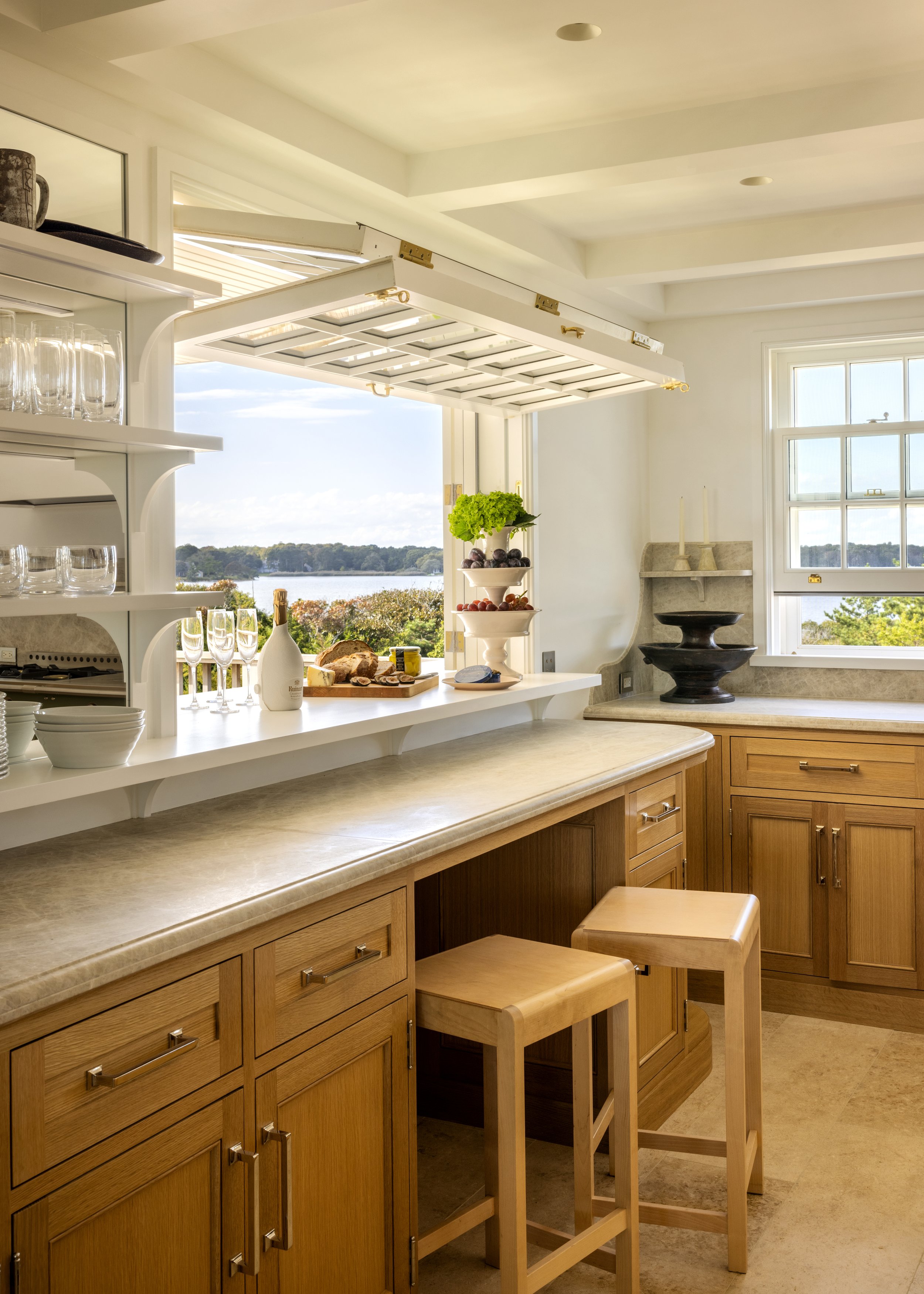Prime for entertaining, the kitchen features a lift-and-fold window for effortless indoor-outdoor entertaining.