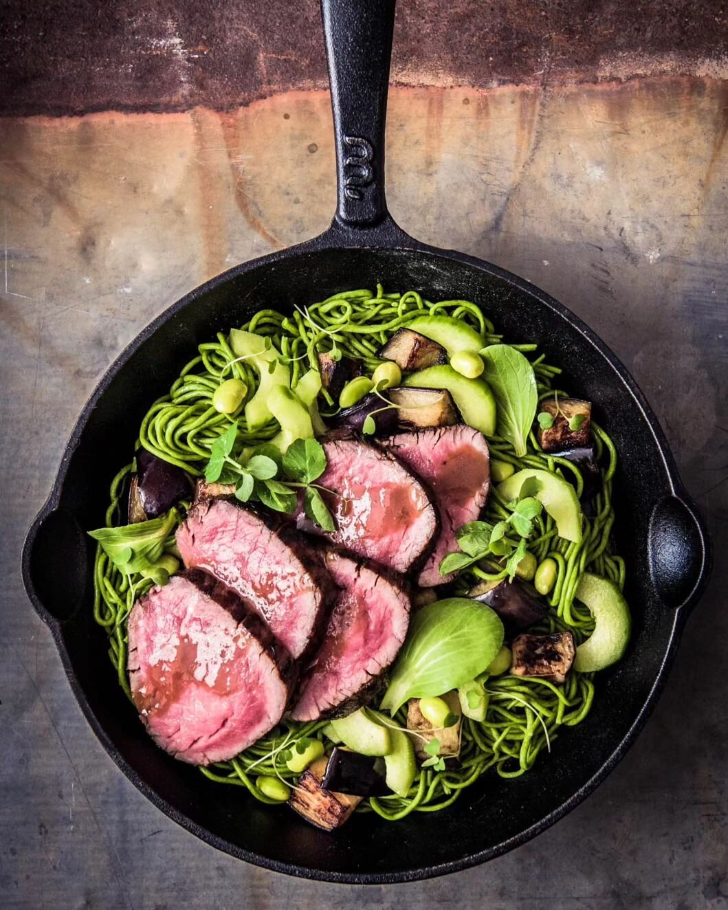 Asian Beef and Green Noodle Salad. &bull;Recipe in bio&bull;
Lightly seared beef fillet rounds, tossed in spinach noodles with cucumber, edamame beans and aubergines. Drizzled with a fragrant Asian dressing and garnished with micro herbs.

Recipe dev