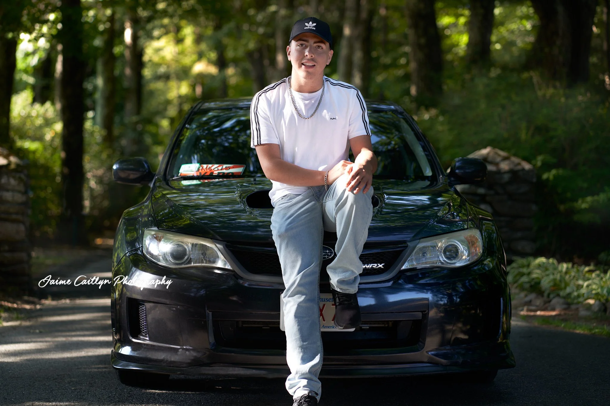 Senior male standing in front of his car outside in Central Massachusetts