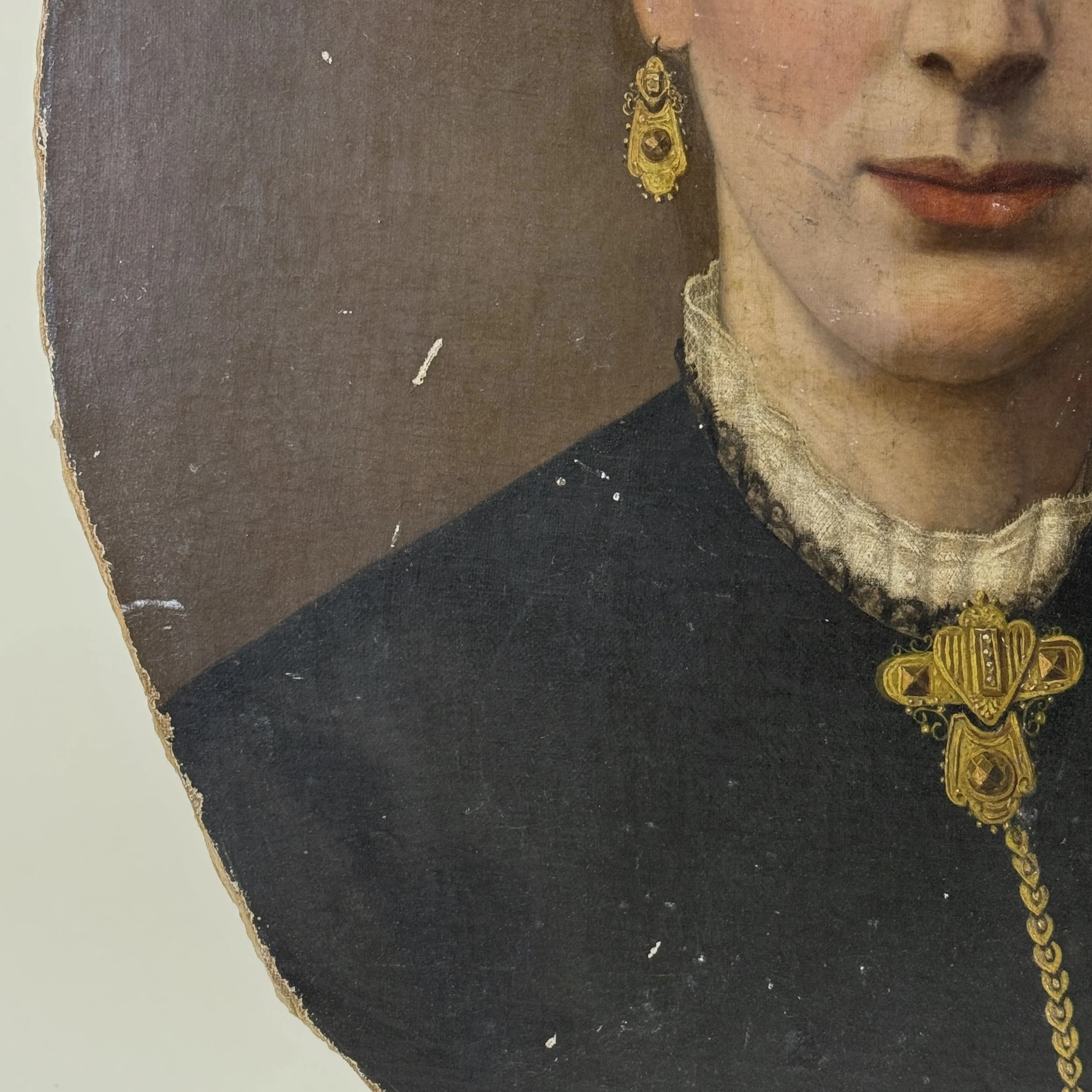 Earring detail. Gold jewelry. Ornate design.