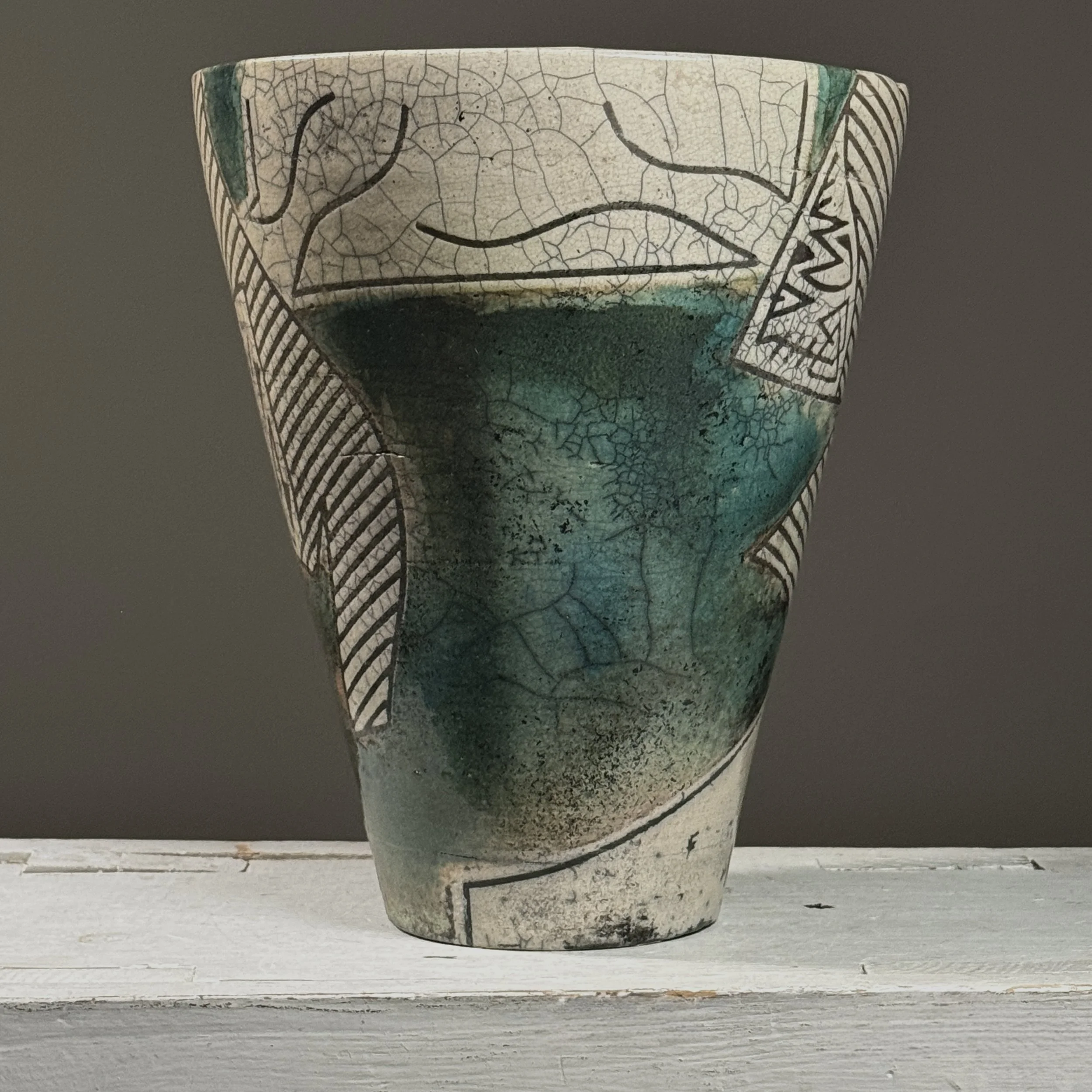 Full view of vintage 1984 postmodernist raku crackle glaze ceramic vessel, signed on side, blue-green glaze areas and black line detail