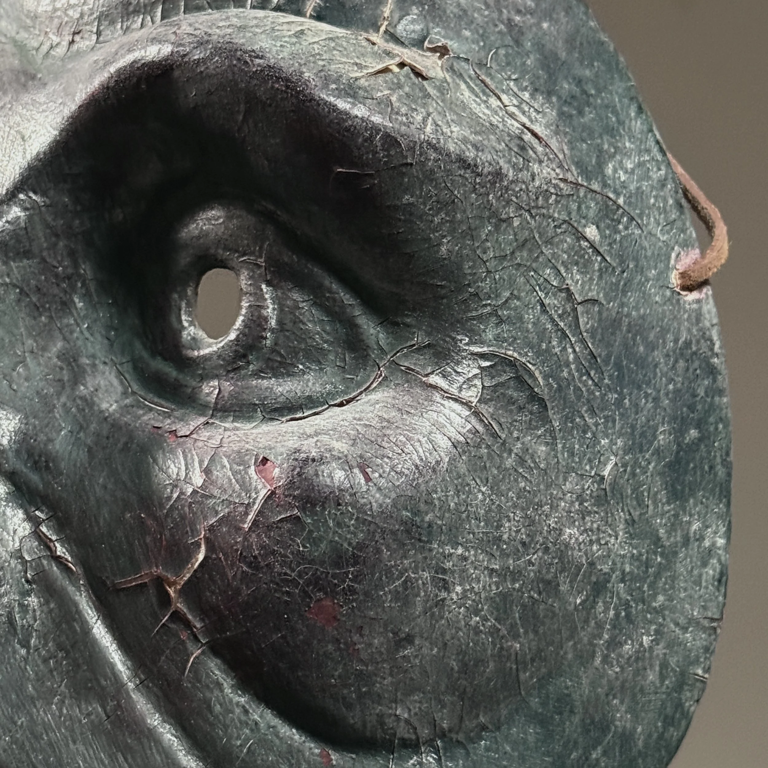 Purple veining detail. Color variations across mask surface.