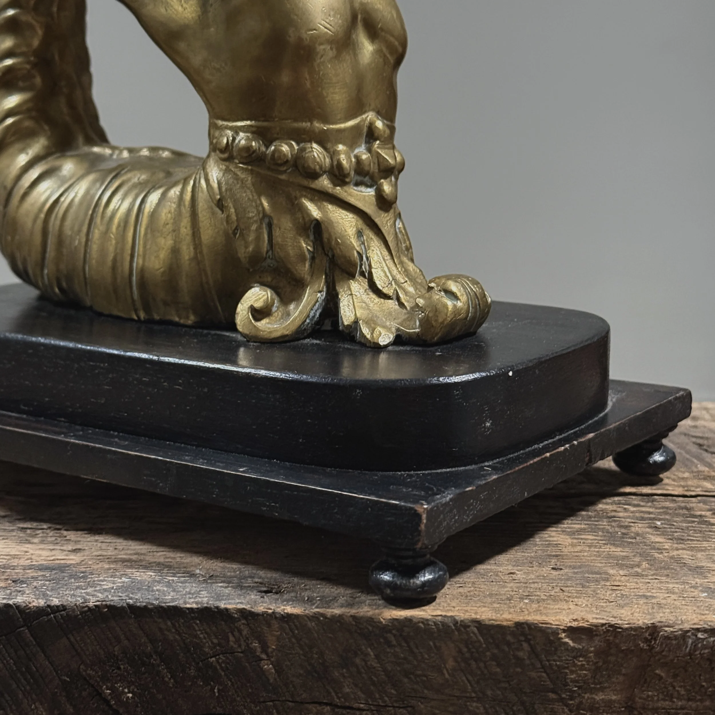 Detail view, pair of brass Melusine sculptures, Neoclassical style