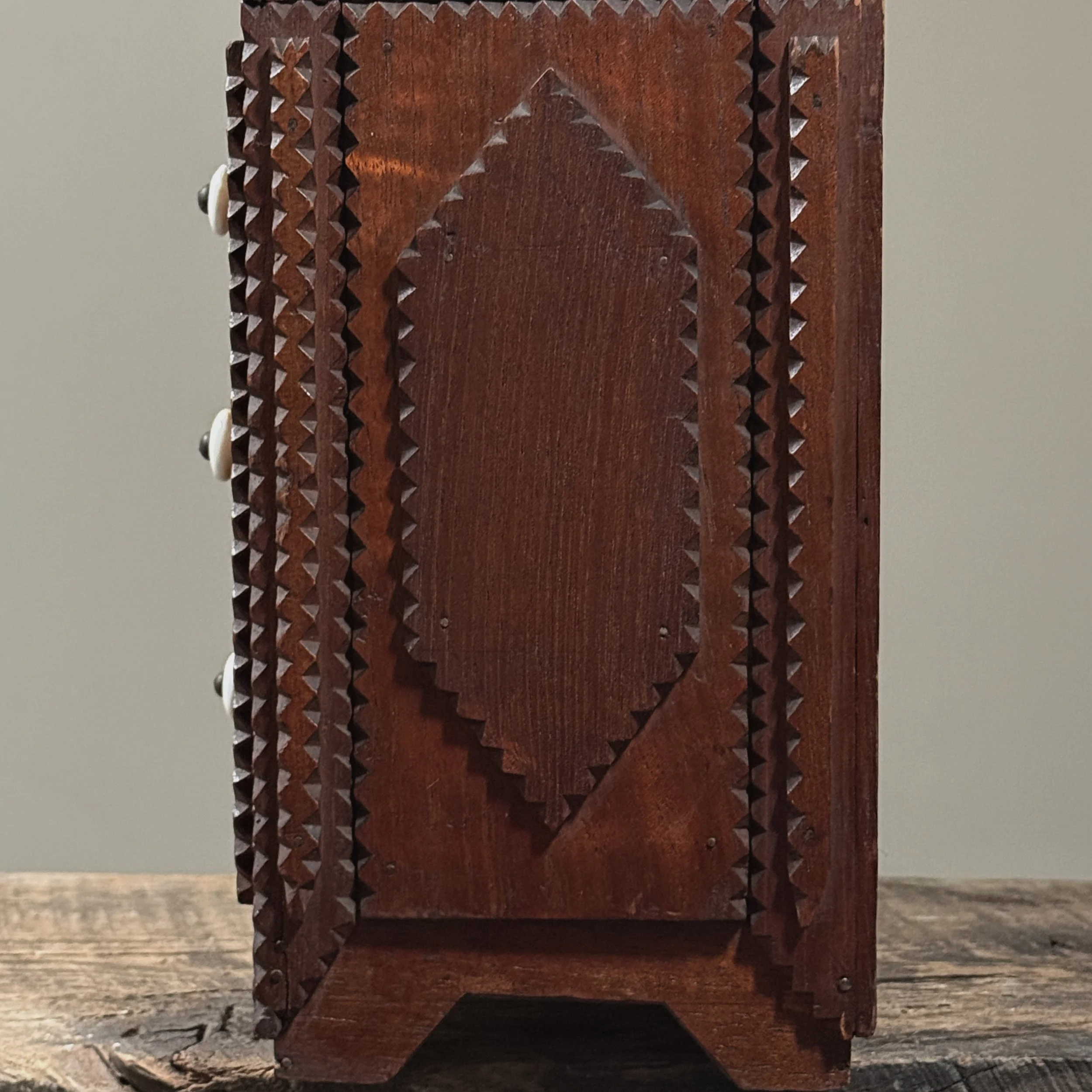 Detailed side view of the dresser.